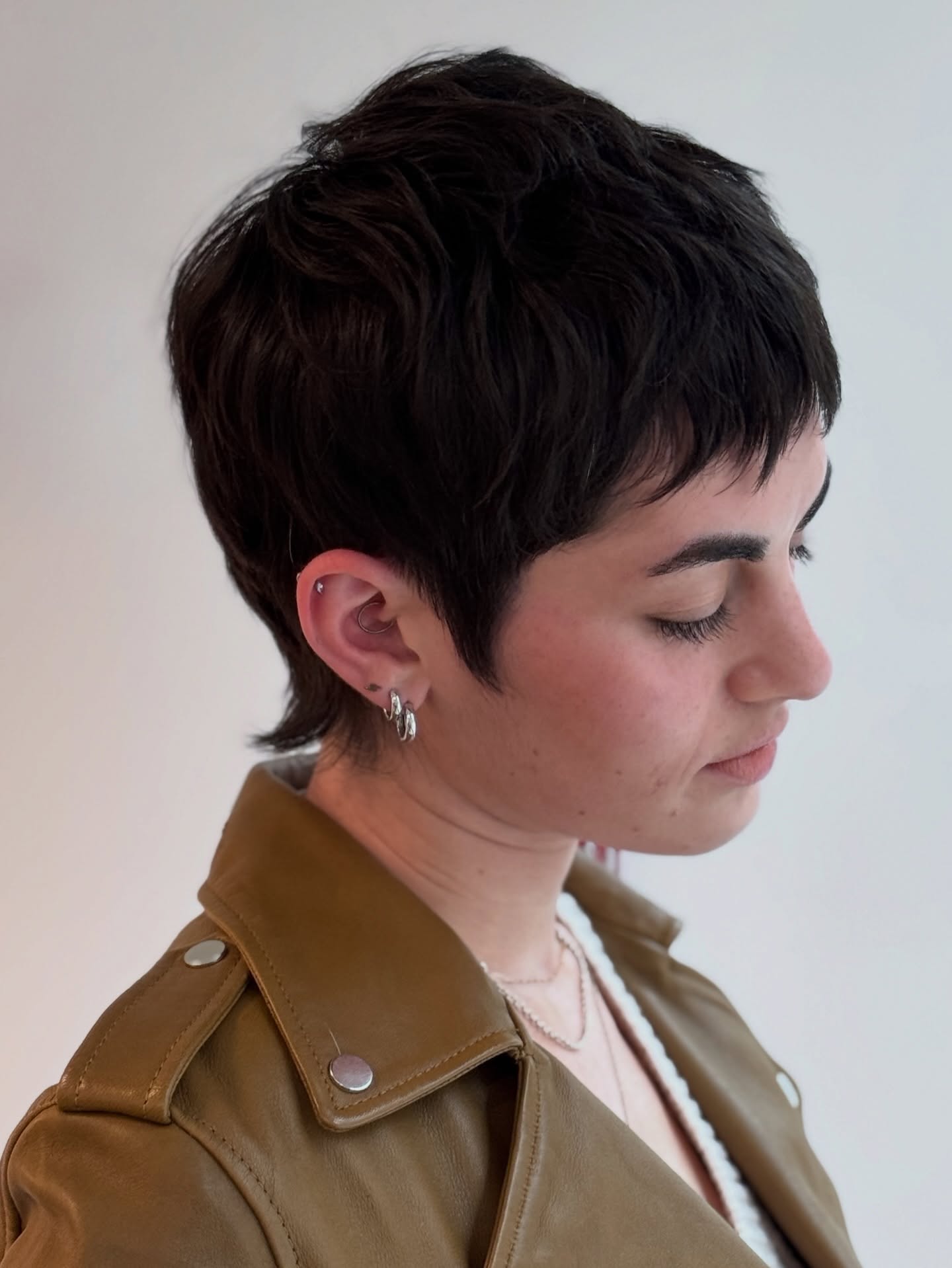 Sleek Deep-Black Layered Pixie with Textured Fringe
