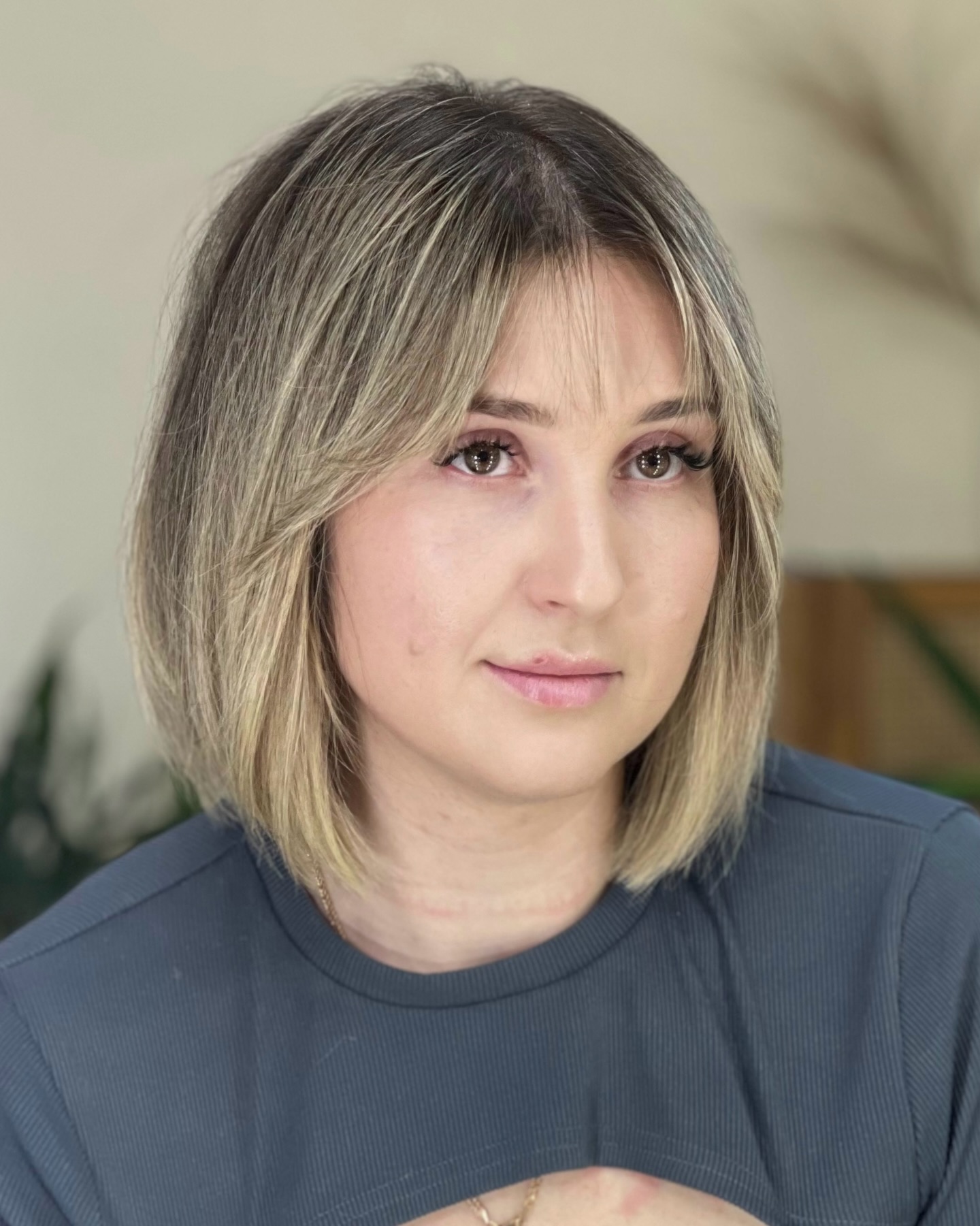 Subtle Ash Blonde Graduated Bob with Face-Framing Highlights