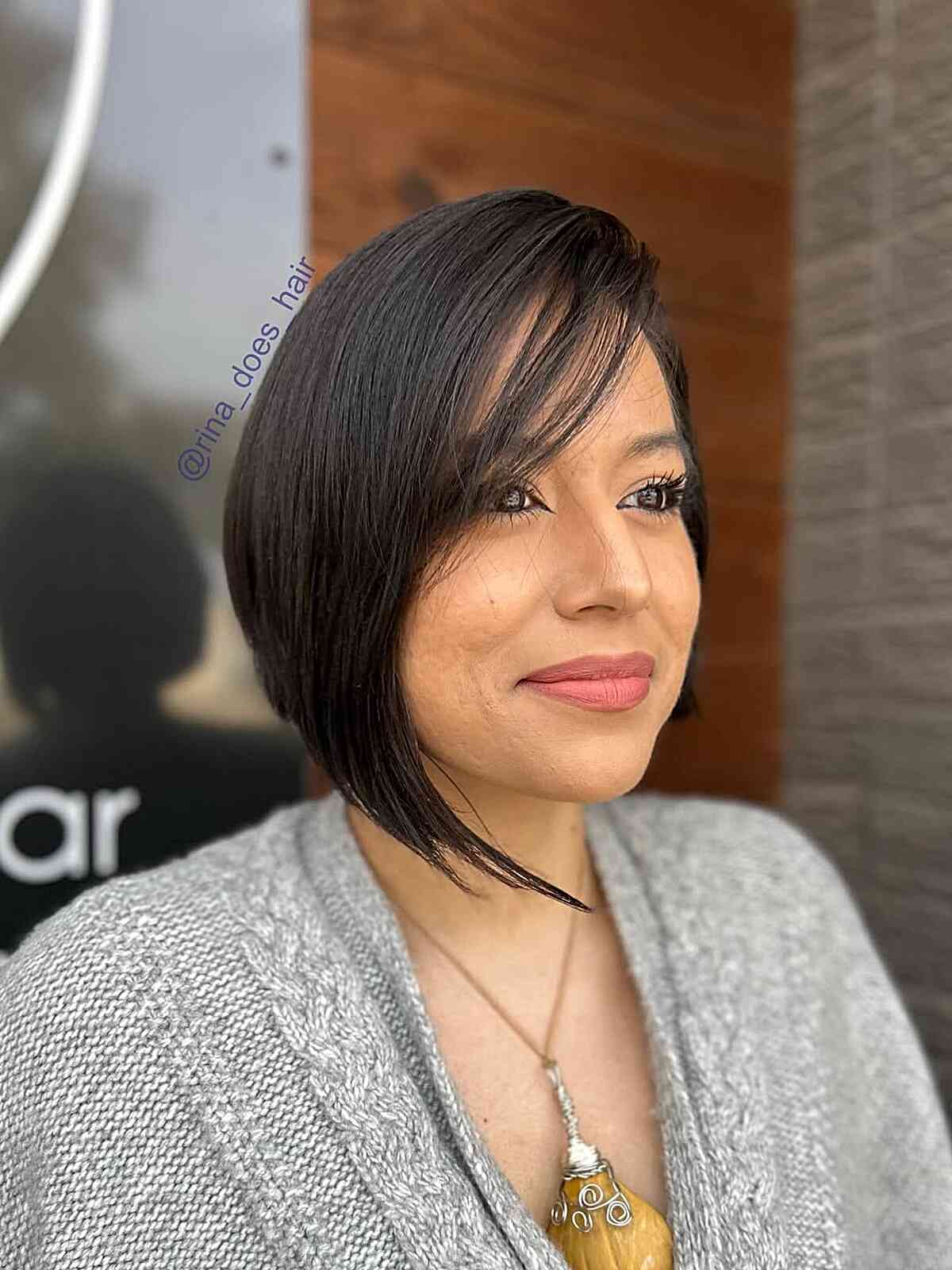 Sleek Angular Bob with Side-Swept Bangs