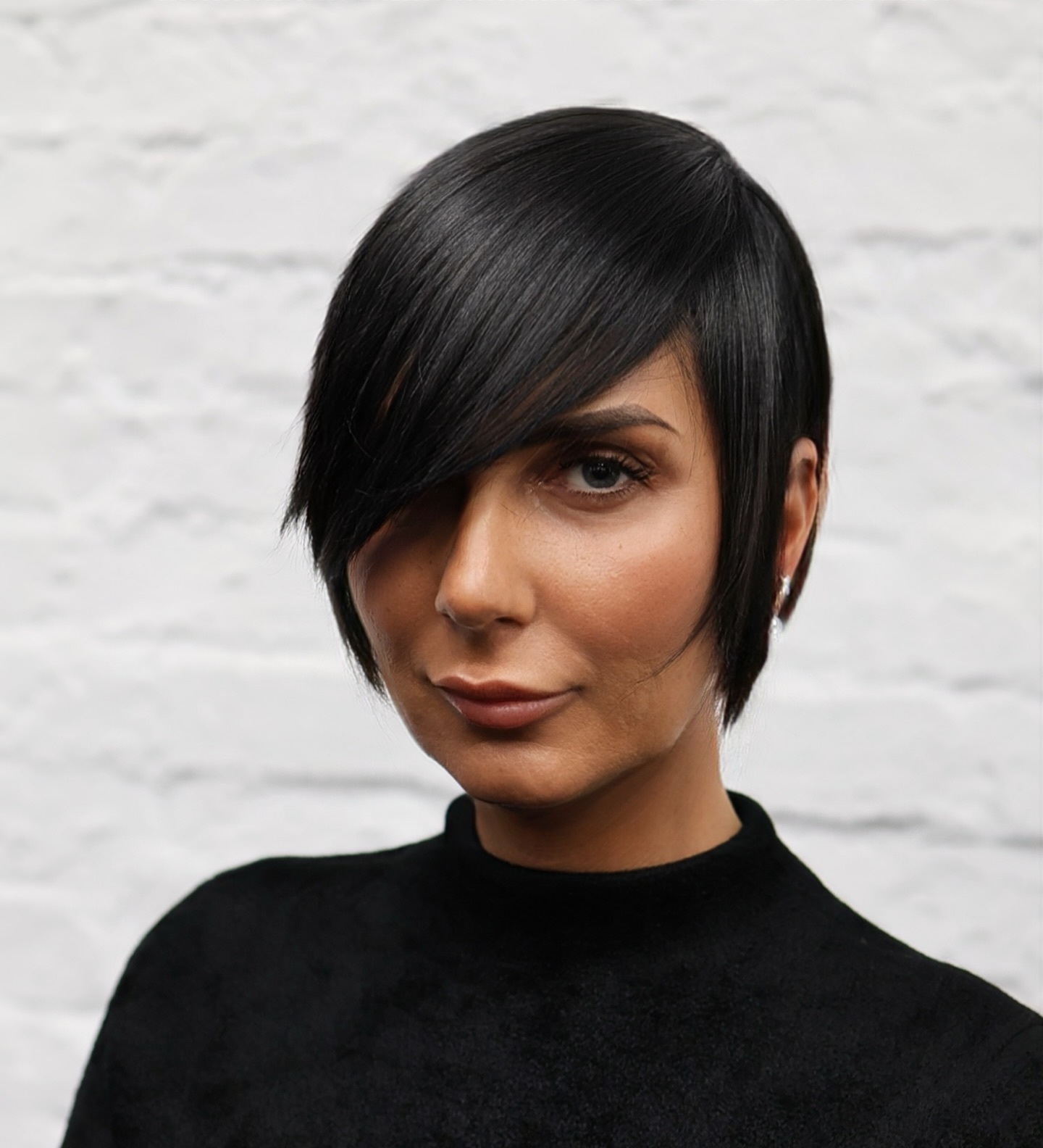 Sleek Jet-Black Asymmetrical Bob with Side-Swept Bangs