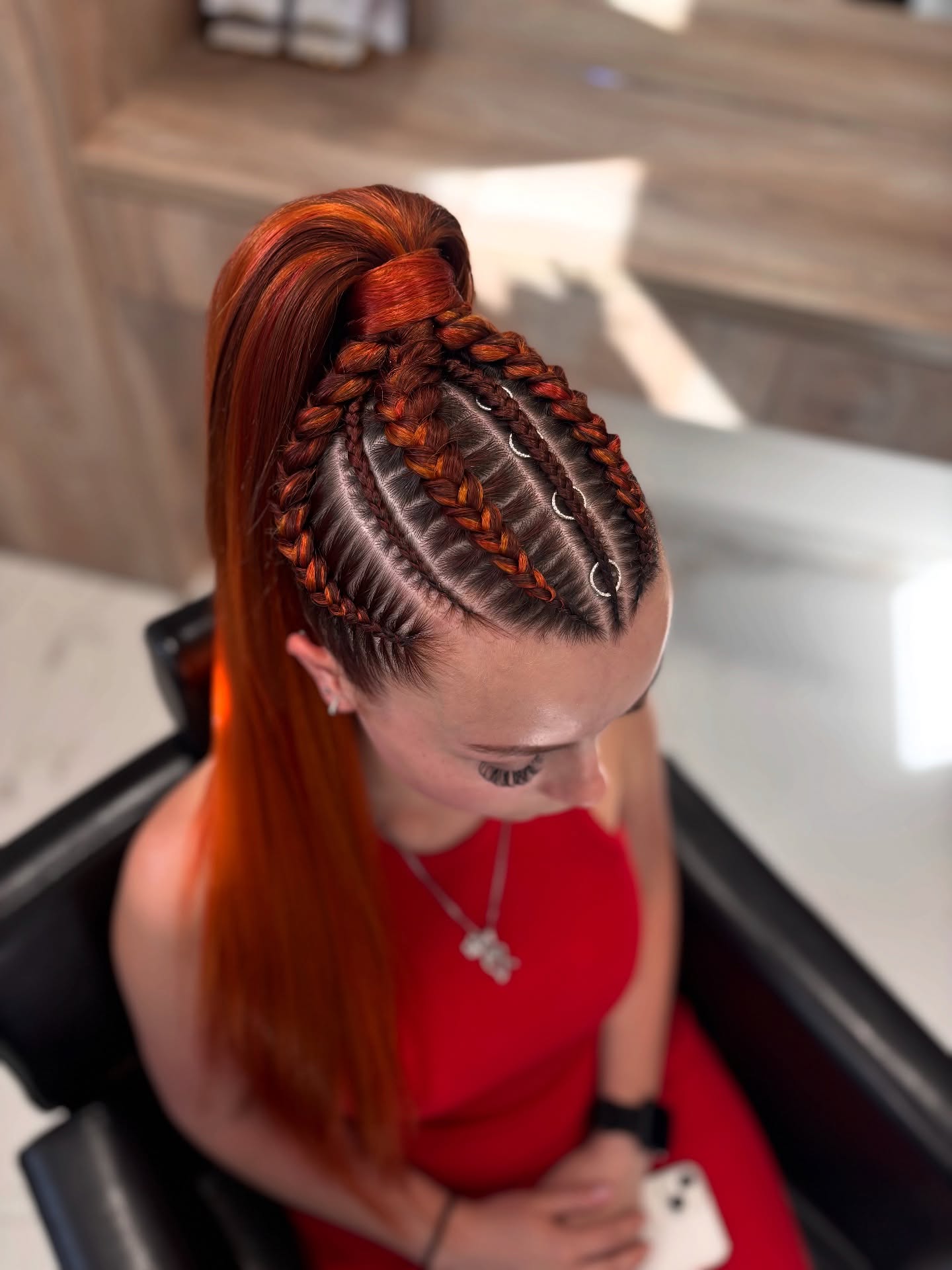 Bold Red Braided Ponytail with Metallic Accents