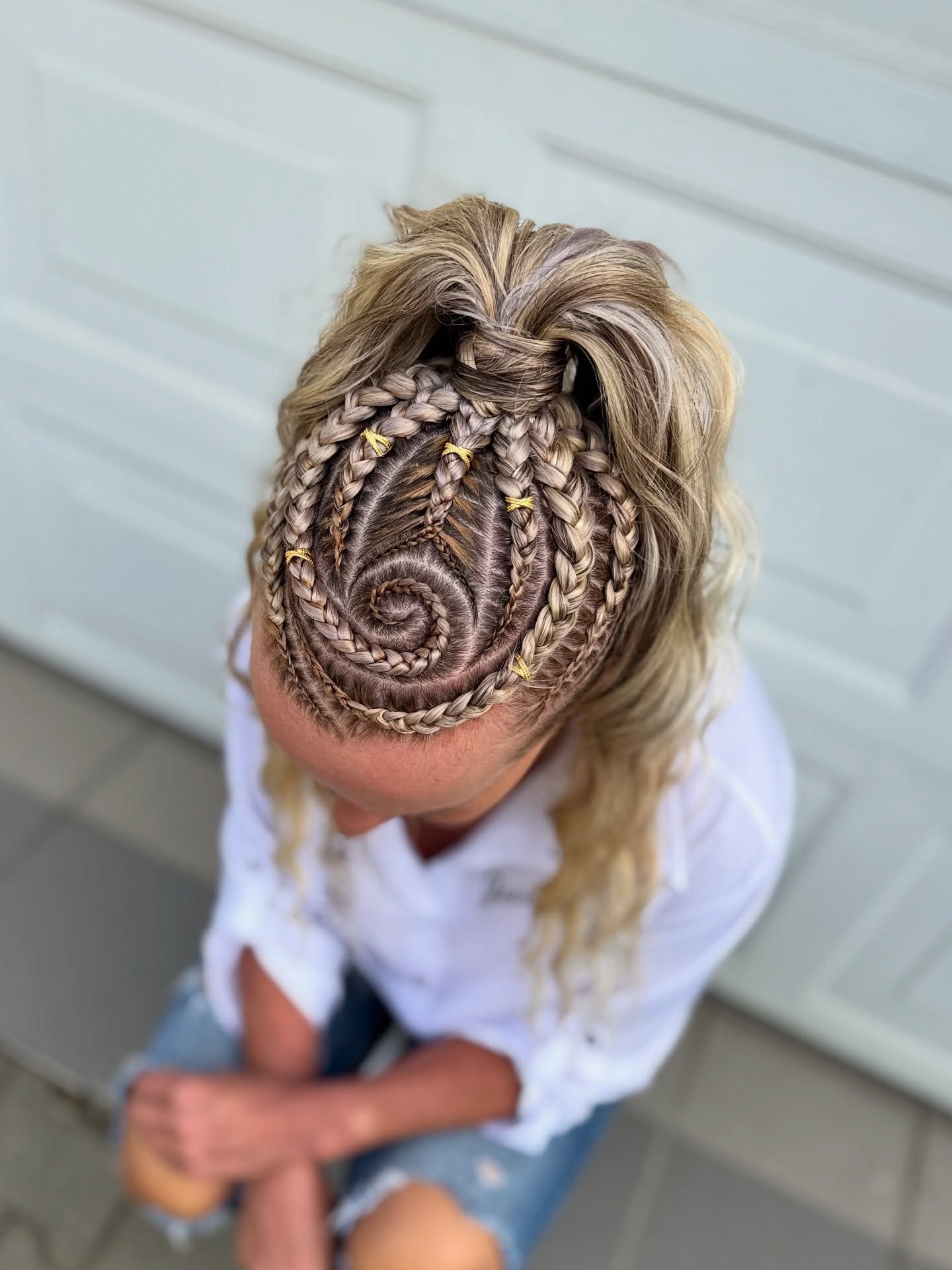 Creative Spiral Braid Updo with Golden Accents