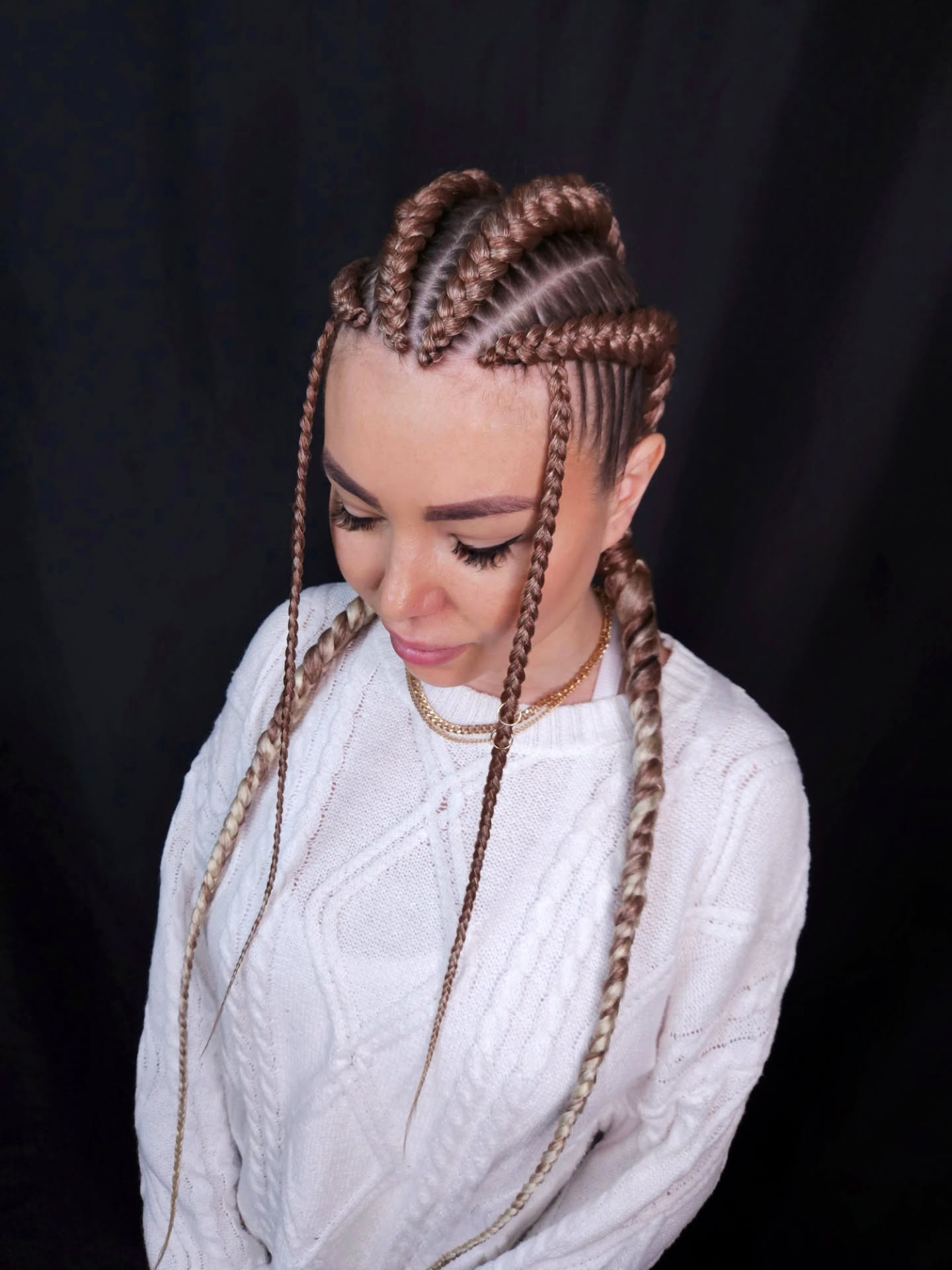 Intricate Cornrow Braids with Playful Loose Ends