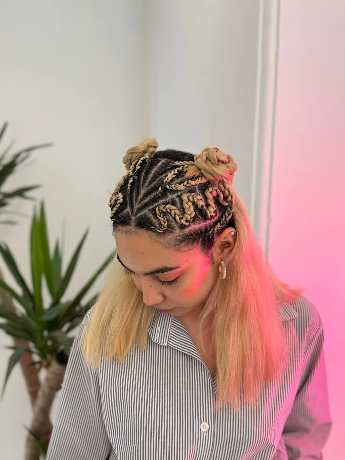 Intricate Twisted Braid Updo with Playful Bun Accents