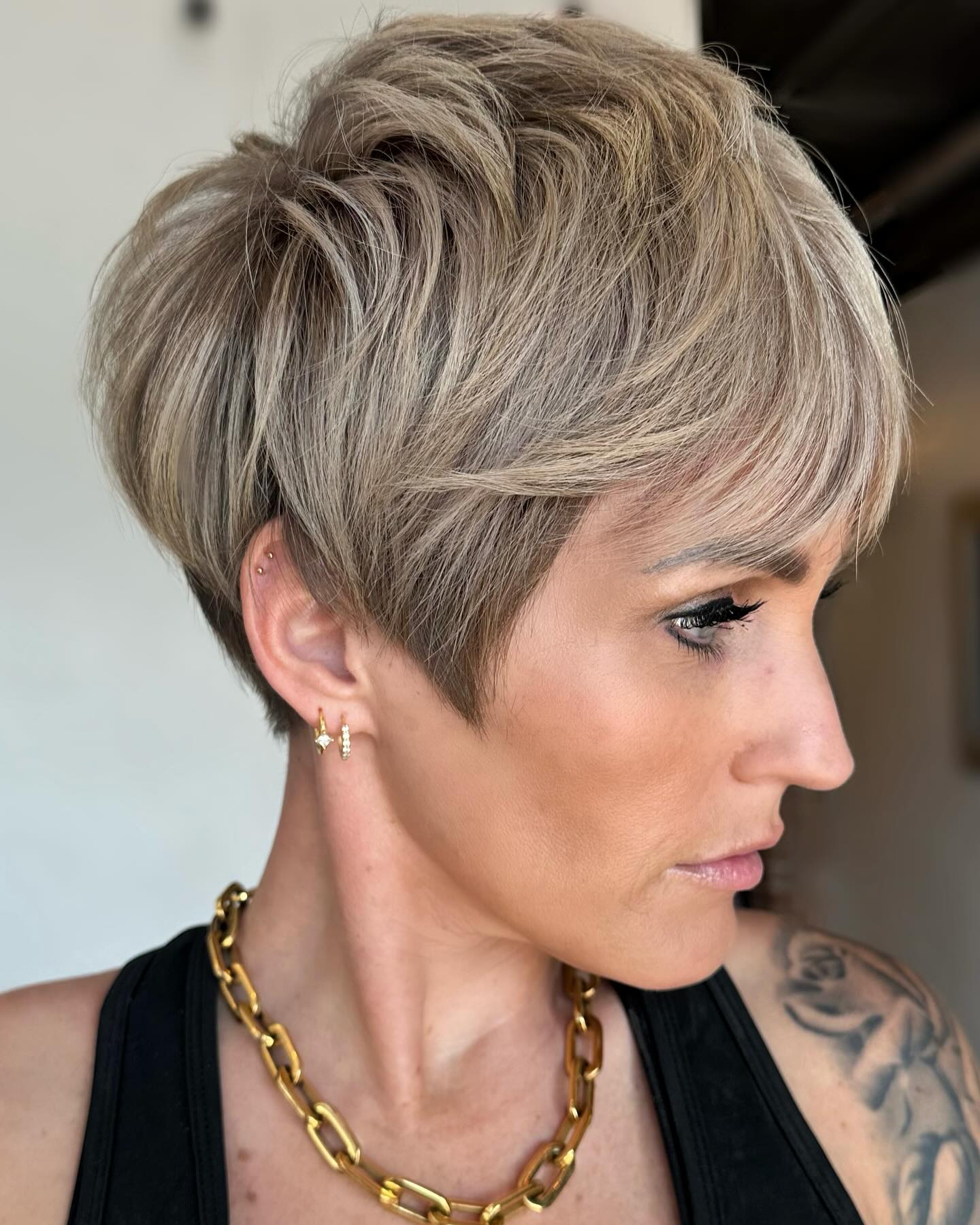 Ash-Blonde Pixie with Layered Crown and Side-Swept Fringe