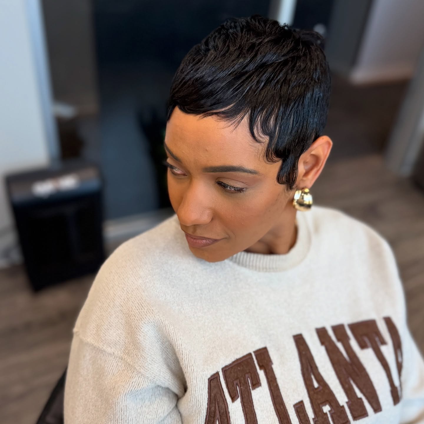 Jet-Black Micro Pixie with Curved Front Swoop and Tapered Nape