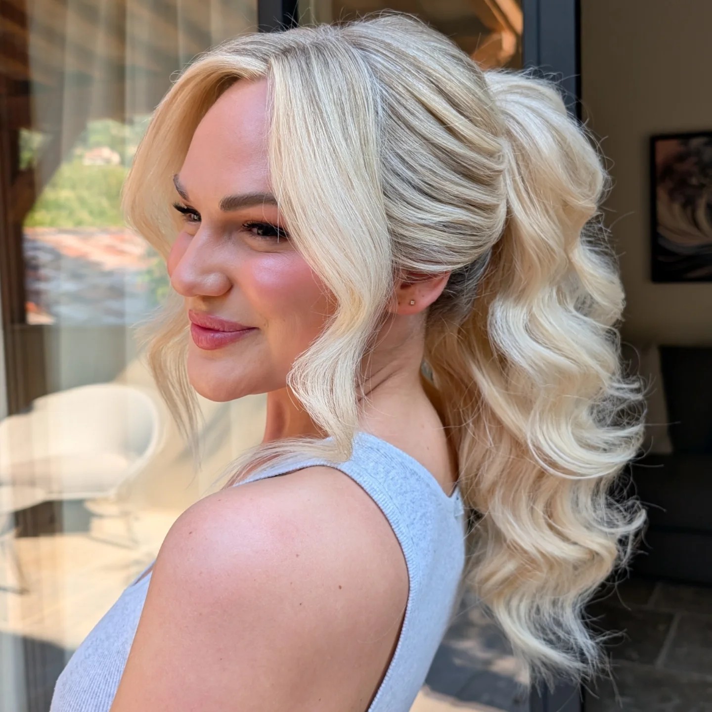 Glamorous Platinum-Blonde Half-Up, Soft-Waved Hair with Face-Framing Layers