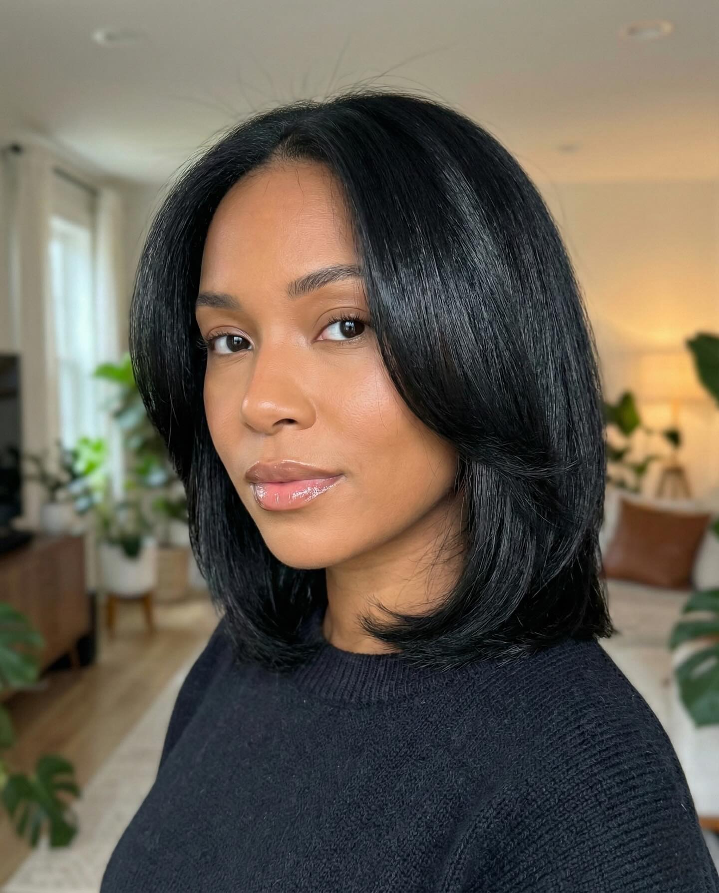 Sleek Shoulder-Length Black Bob with Soft Face-Framing Layers