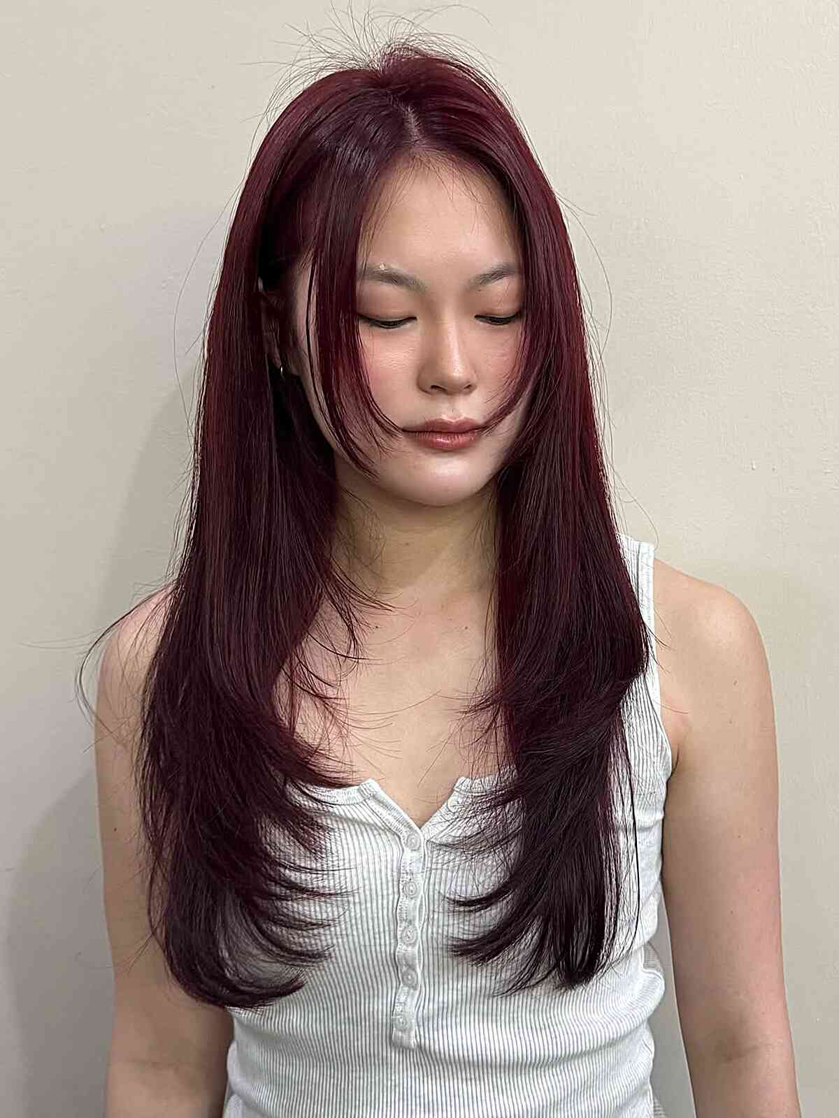 Stylish Long Layered Straight Haircut with Subtle Face-Framing Layers