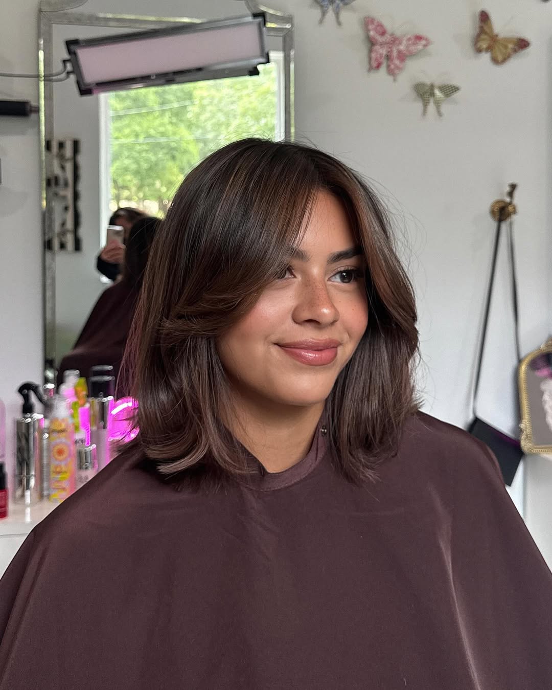 Stylish Medium-Length Haircut with Soft Curtain Bangs