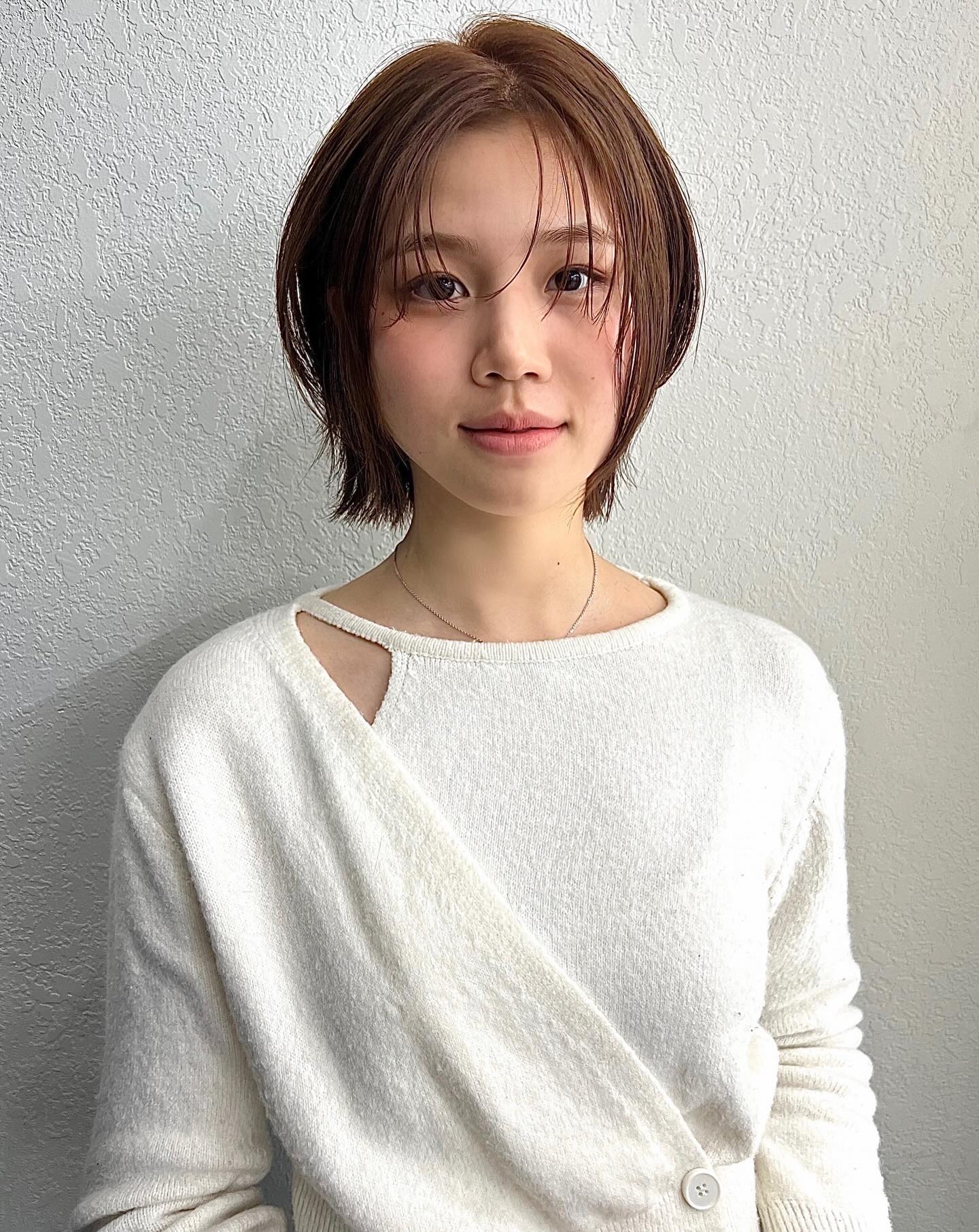 Short Layered Chin-Length Bob with See-Through Curtain Fringe and Subtle Nape Flip