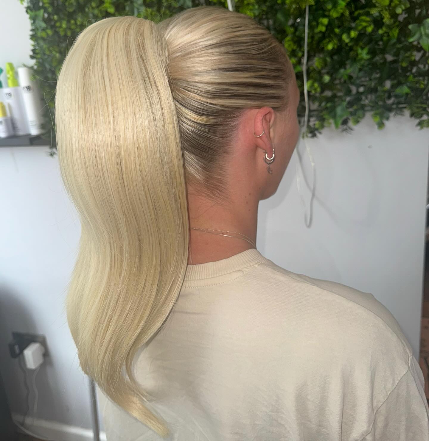 Platinum Sleek High Ponytail with Subtle Root Melt