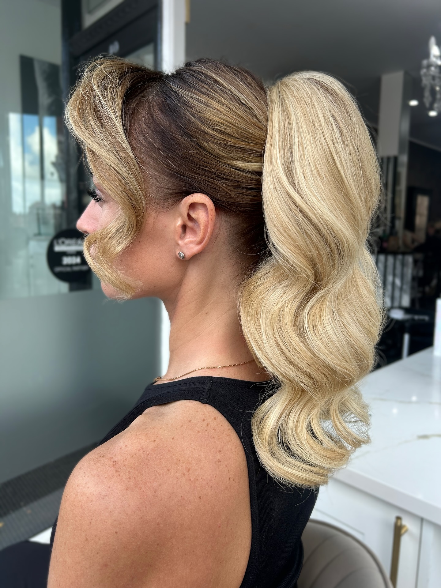 Sculpted Blonde S-Wave Ponytail with Wrapped Base and Root Melt