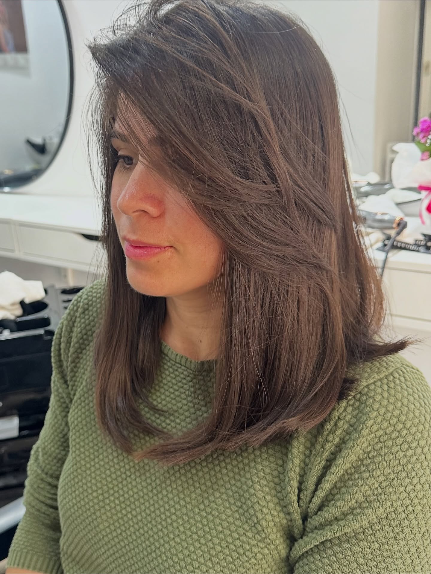 Soft Feathered Shoulder-Length Chestnut Layers with Face-Framing Sweep