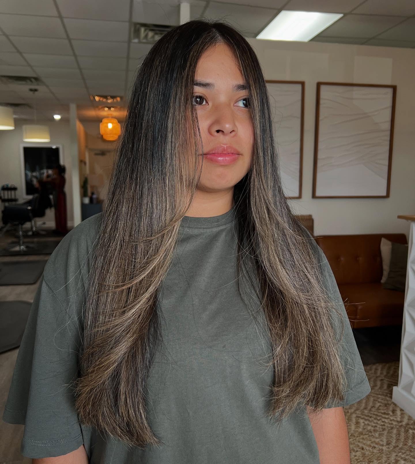 Chic Long Layered Cut with Warm Highlights