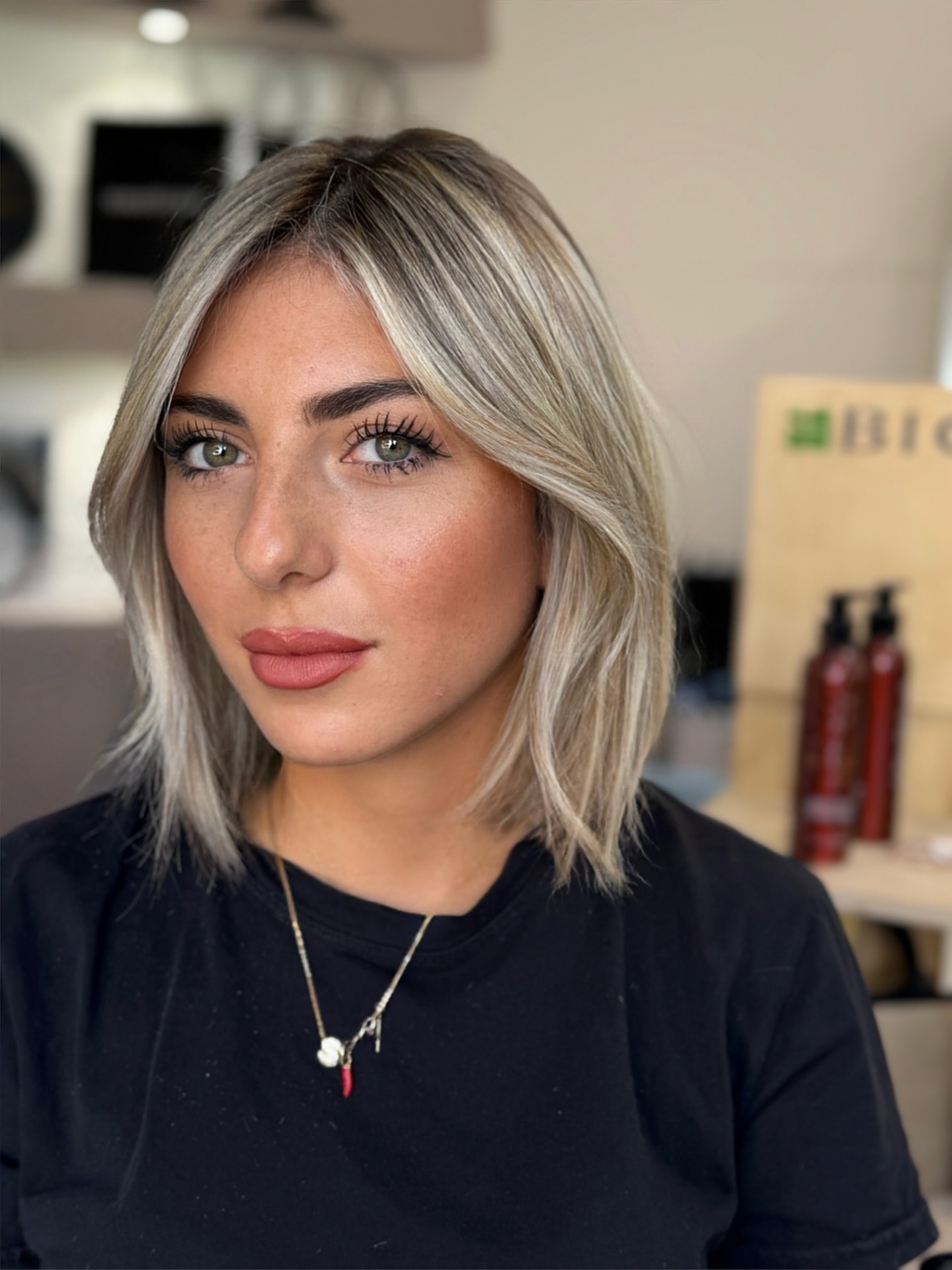 Cool Ash-Blonde Mid-Lob with Subtle Center Curtain and Razor-Textured Ends
