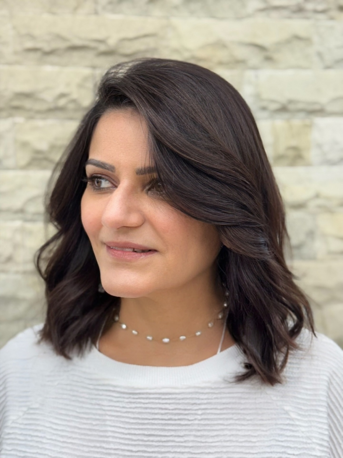 Deep Chocolate Layered Shoulder-Length Lob with Wide Side Sweep
