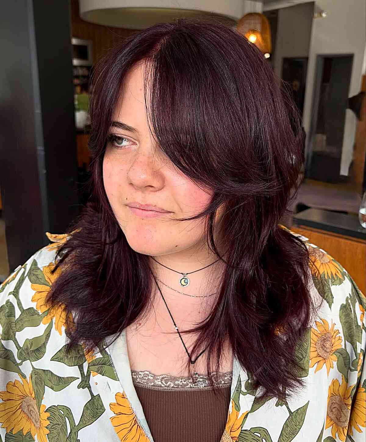 Vibrant Dark Red Layered Cut with Face-Framing Bangs