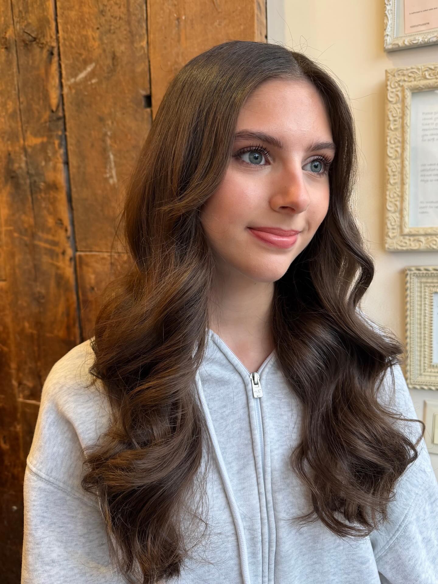 Wide S-Wave Long Cut with Chin-Length Face-Framing Layers
