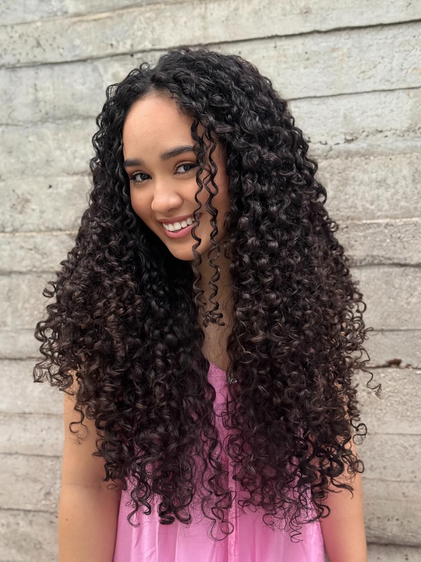 Bold Long Curly Layers with Defined Bounce