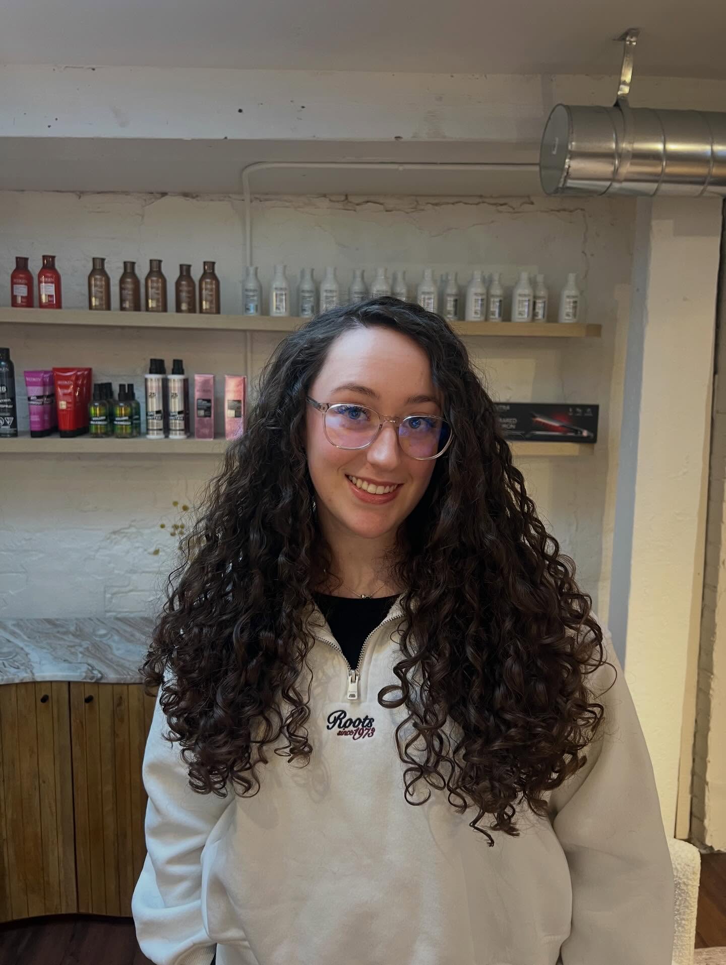 Chic Long Curly Haircut with Defined Curls