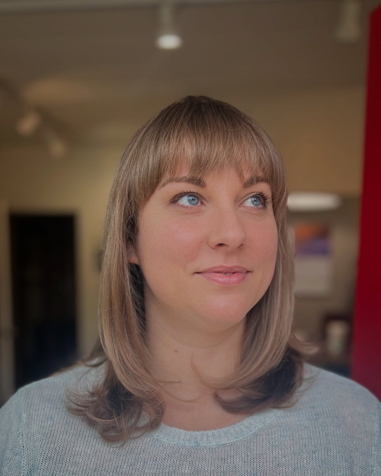 Chic Mid-Length Cut with Soft Blunt Bangs