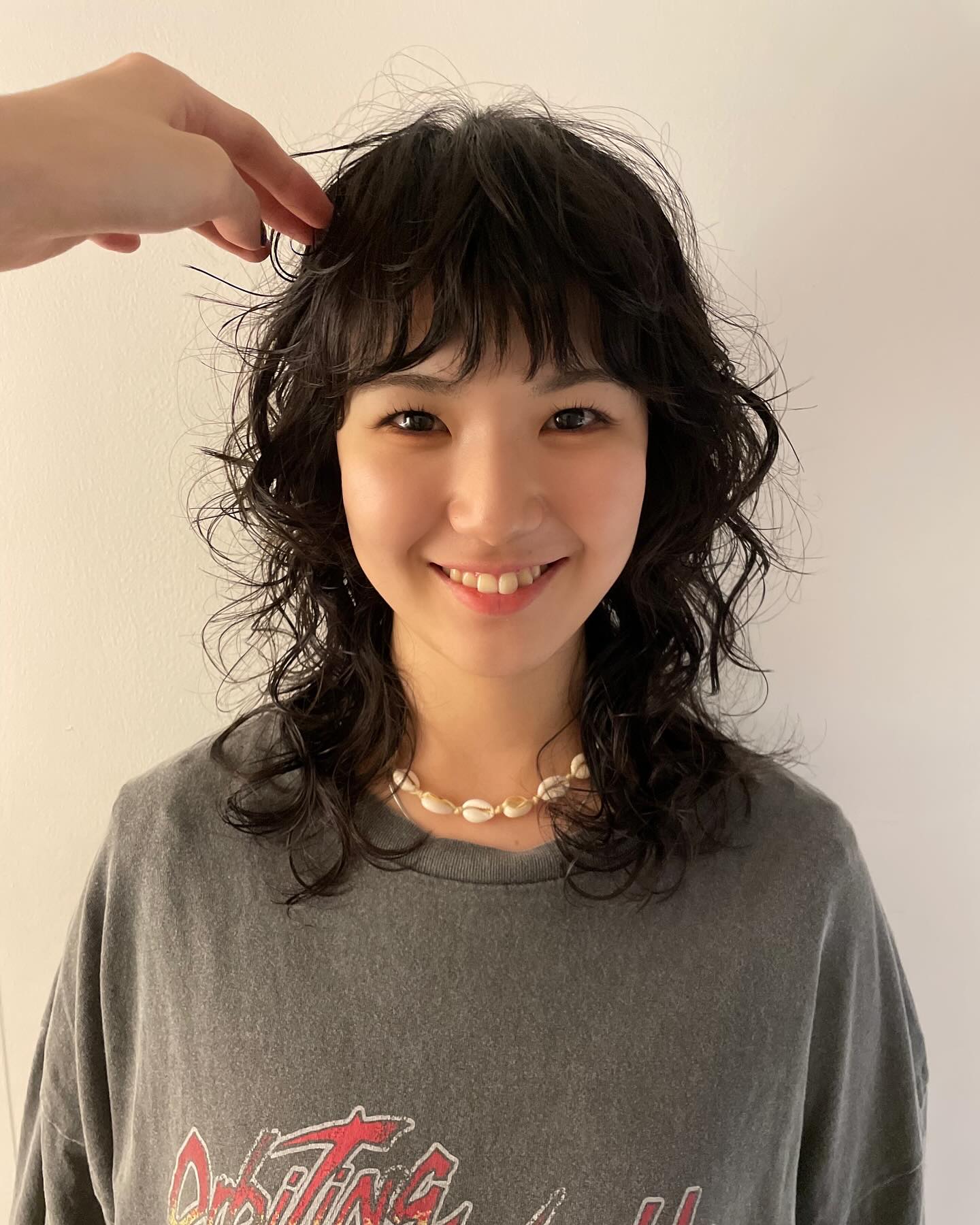 Curly Collarbone-Length Shag with Short Textured Fringe