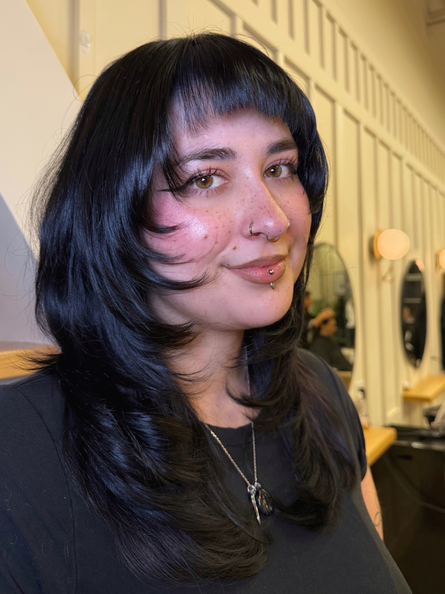 Jet-Black Feathered Shag with Micro Blunt Bangs and Face-Framing Flips