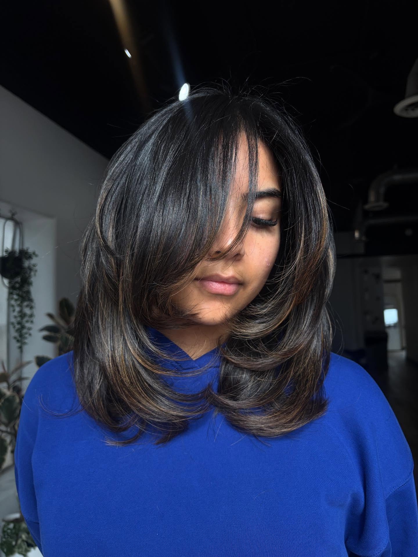 Mid-Length Rounded Layers with Subtle Face-Framing Lowlights