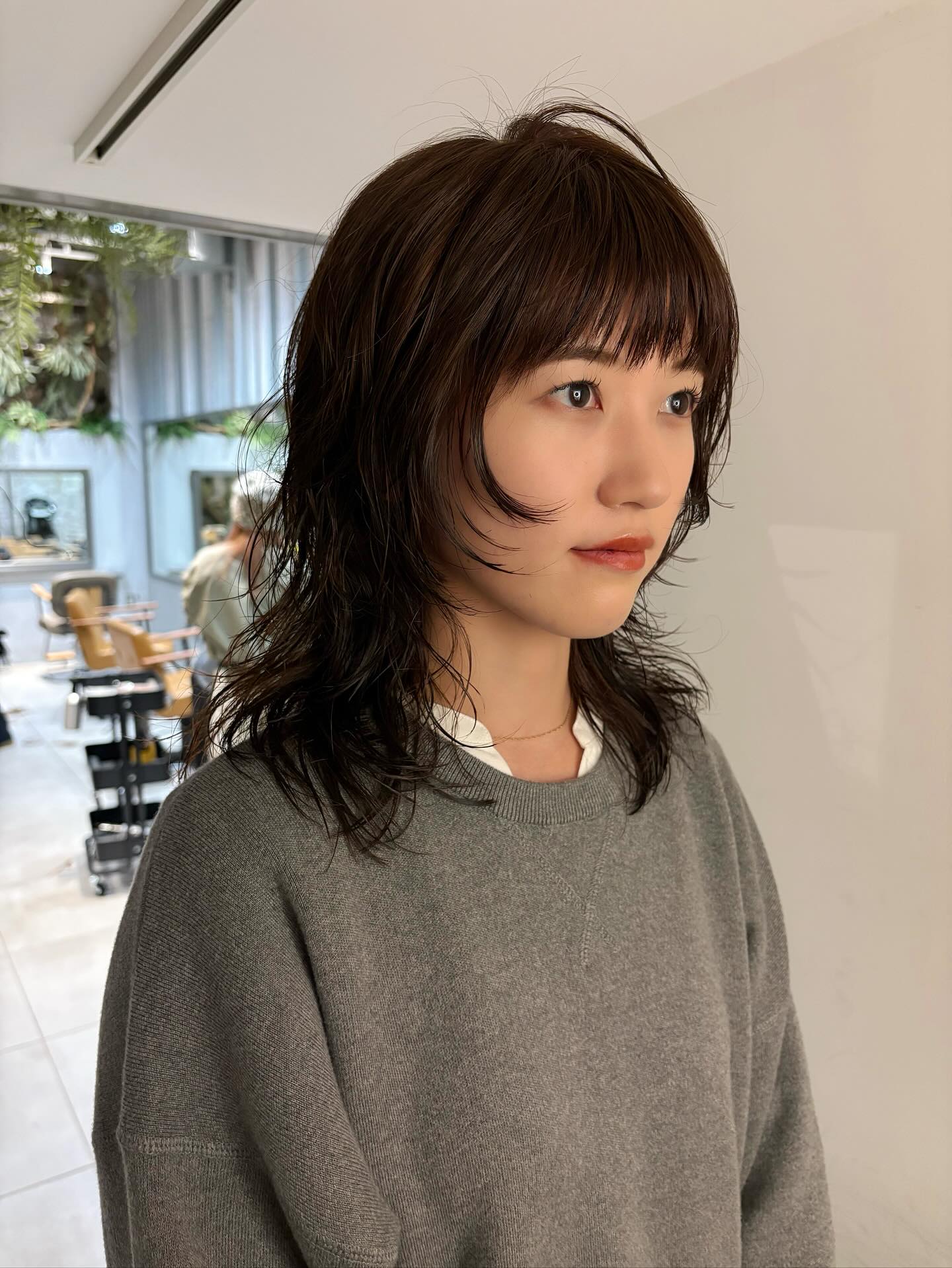 Modern Medium-Length Mullet with Rounded Micro Bangs