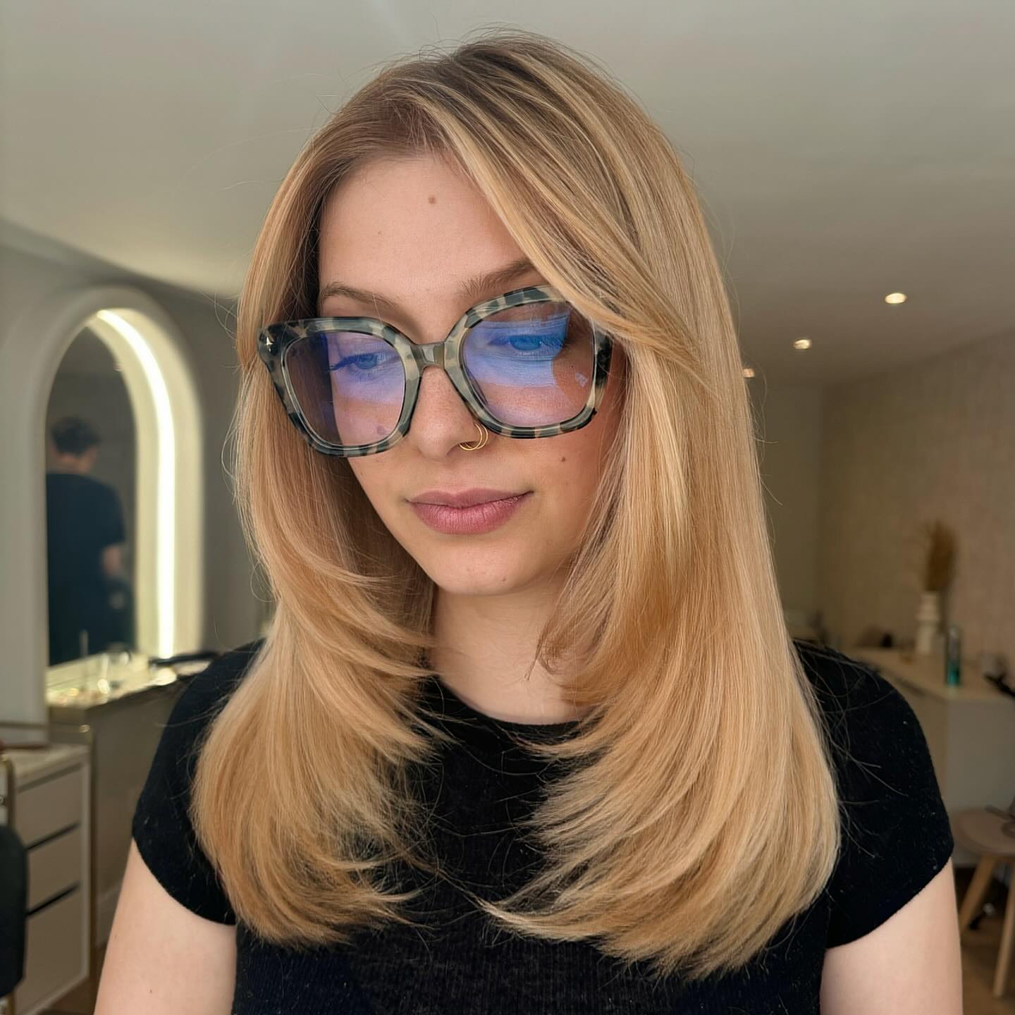 Buttery Blonde Face-Framing Layered Cut with Feathered Ends