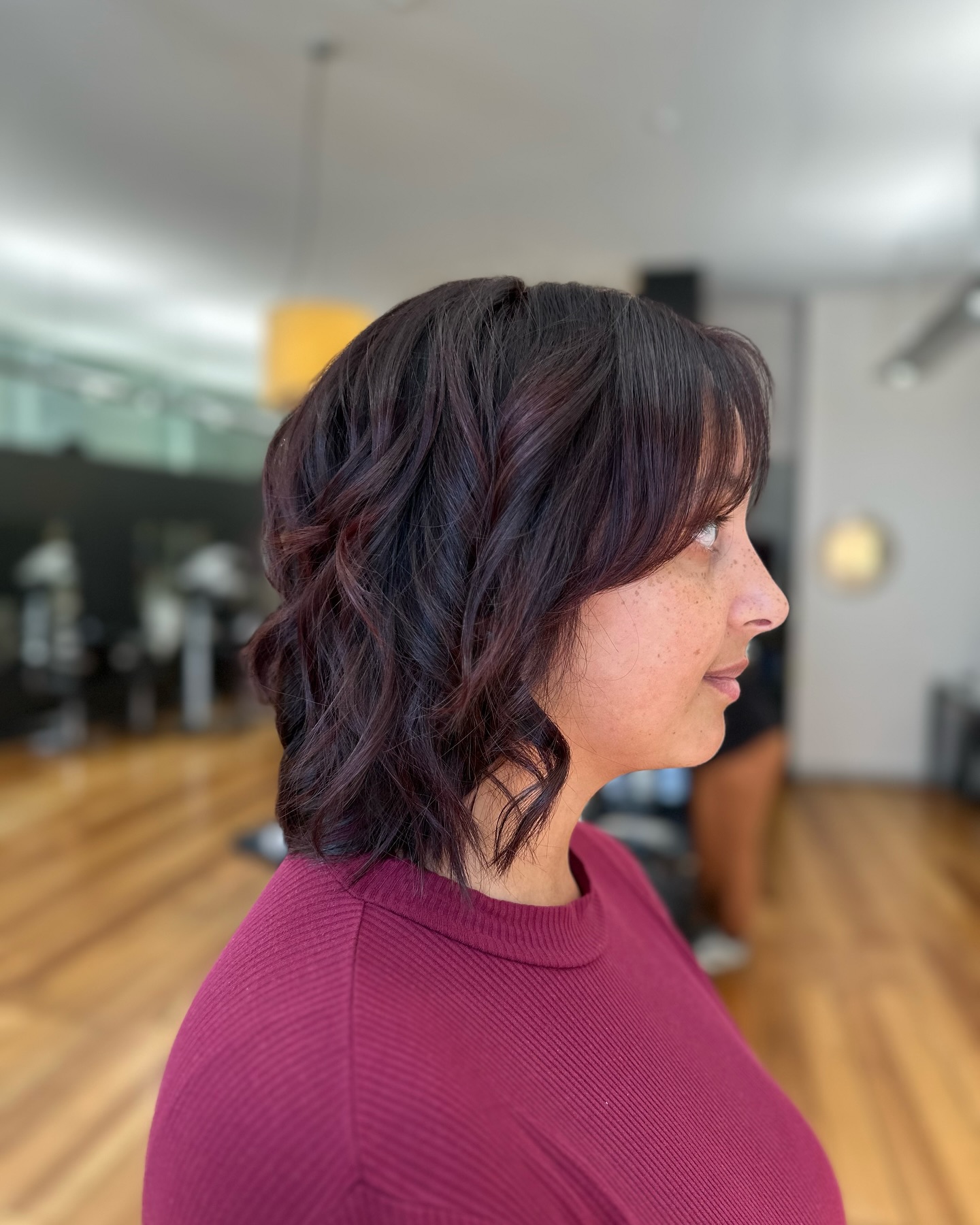 Choppy Textured Chin-Length Bob with Burgundy Peekaboo