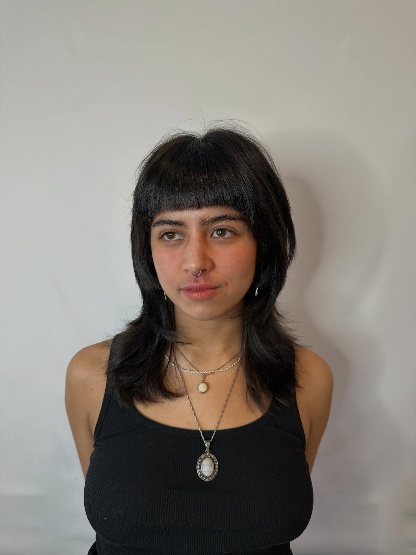 Edgy Micro-Bangs with Choppy Mullet-Inspired Layers