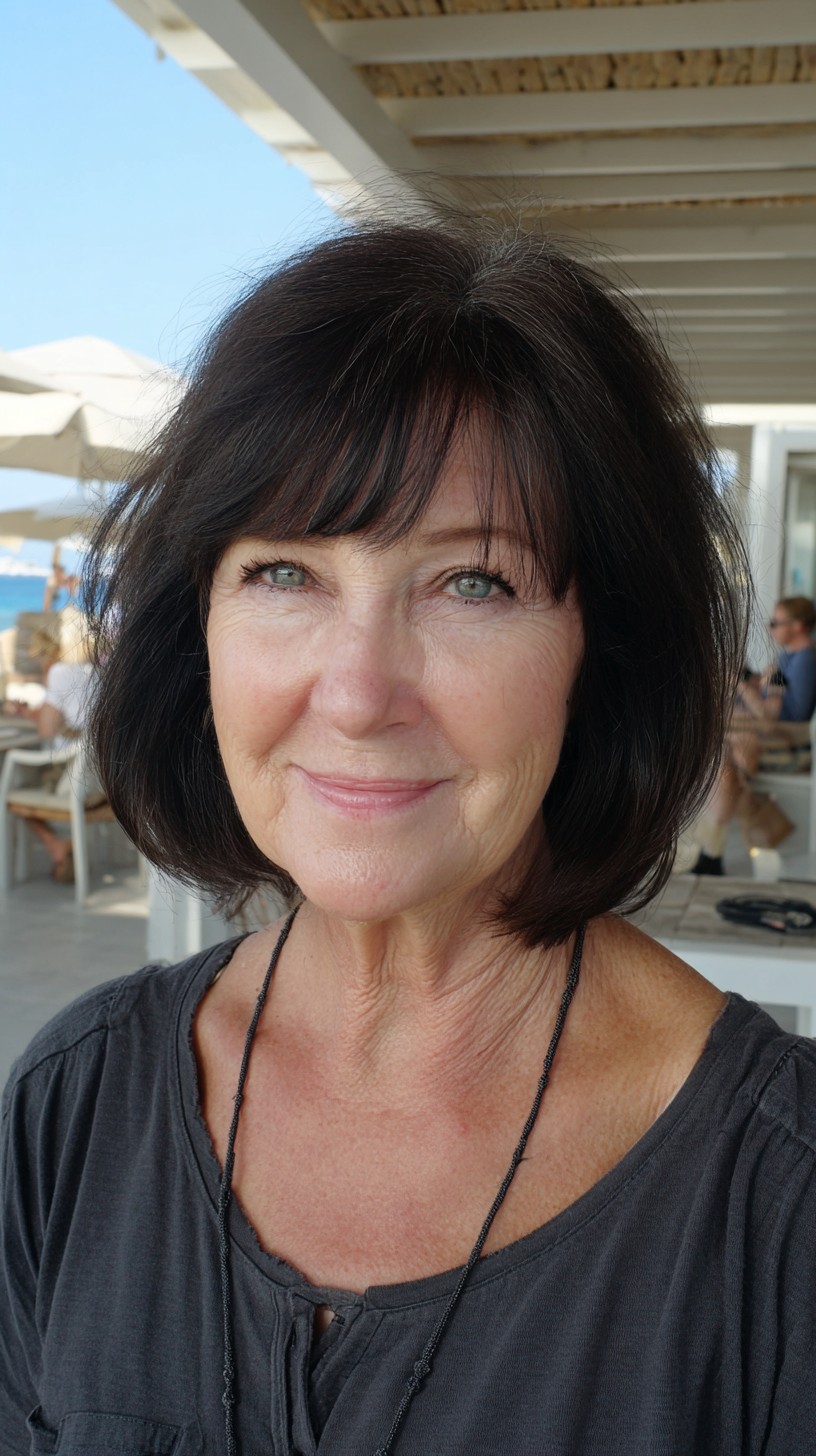 Rounded Chin-Length Layered Bob with Soft Wispy Fringe
