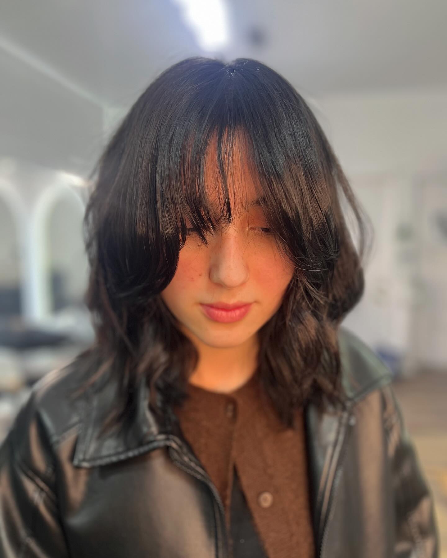 Shoulder-Length Lob with Wispy Curtain Fringe and Rounded Inward Flicks