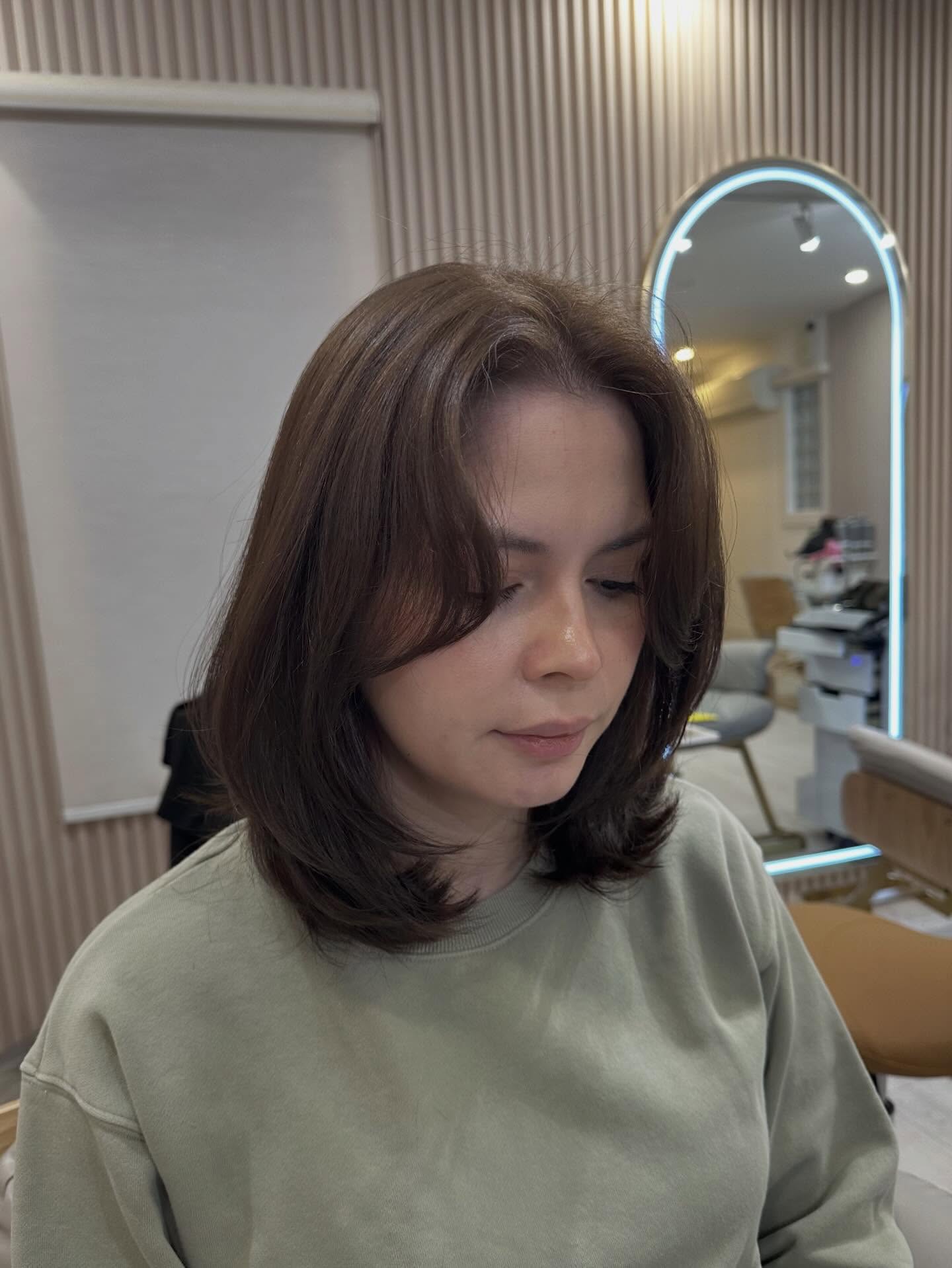 Soft Center-Parted Mid-Length Layers with Rounded Ends
