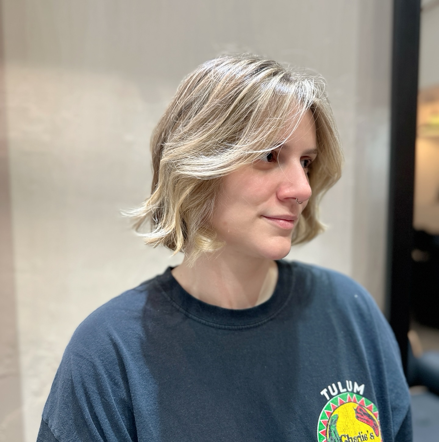 Chin-Length Layered Bob with Curtain Face-Framing and Soft Flicked Ends
