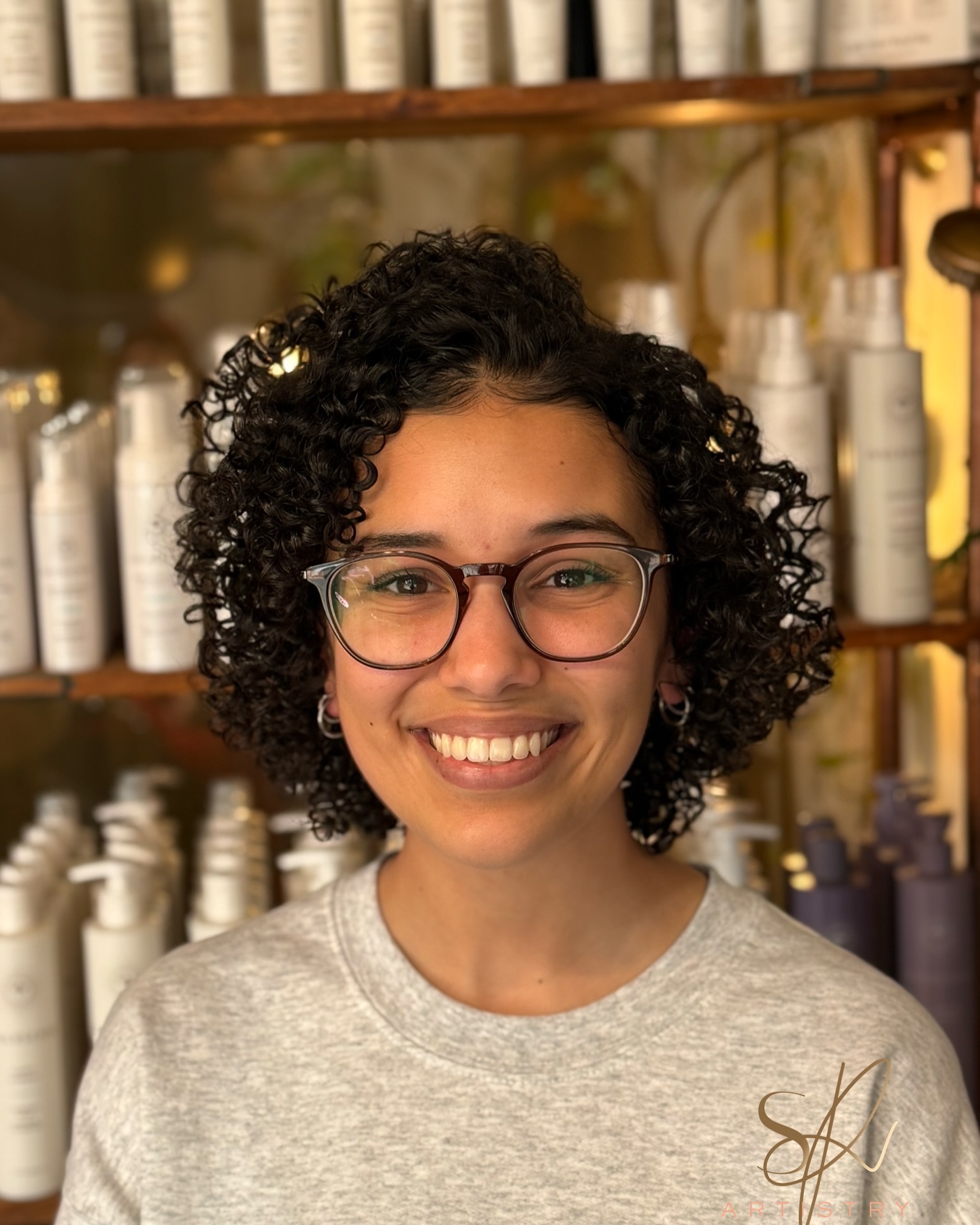 Defined Chin-Length Curly Bob with Tapered Interior Layers