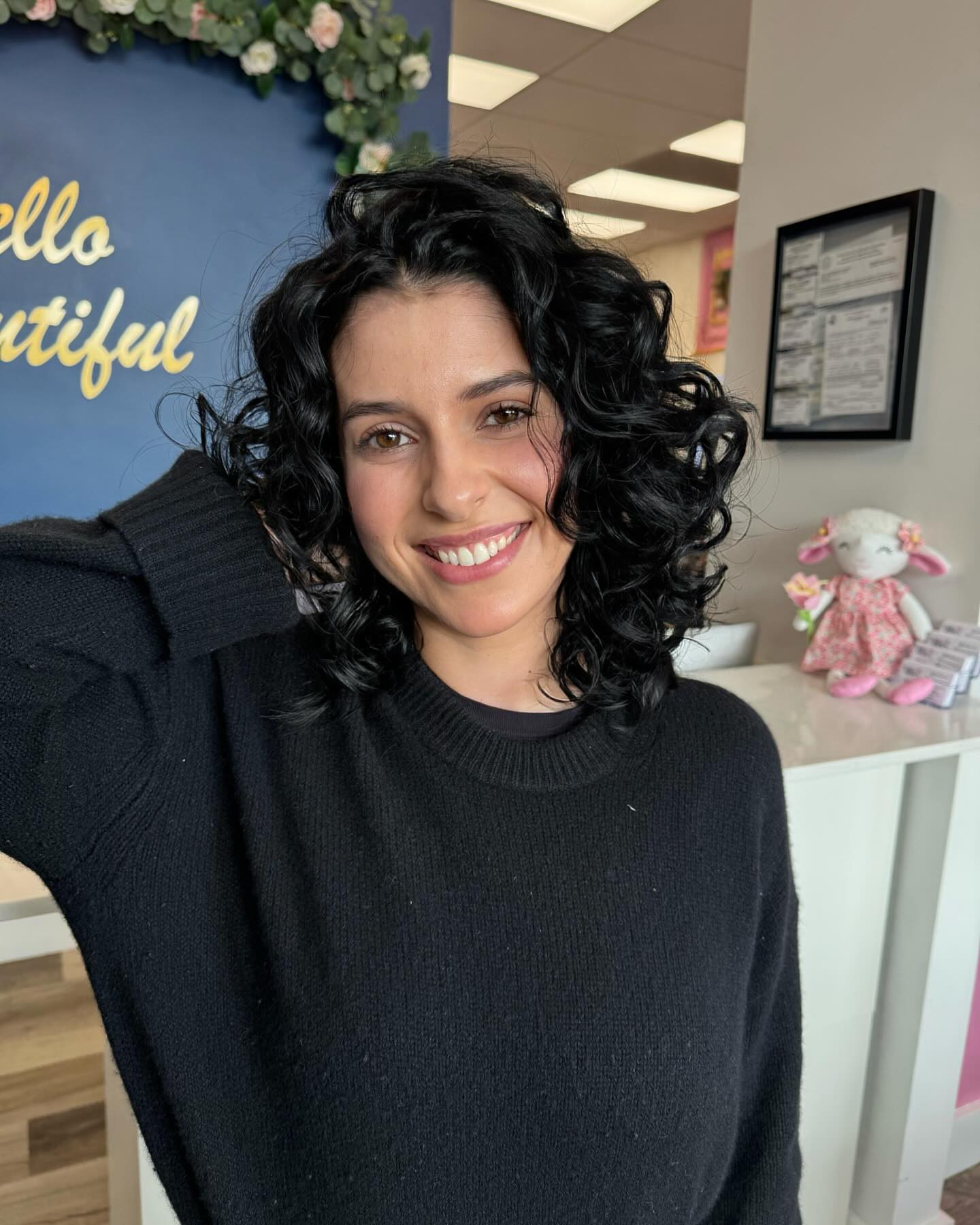 Glossy Black Curly Shoulder-Grazing Bob with Interior Layers