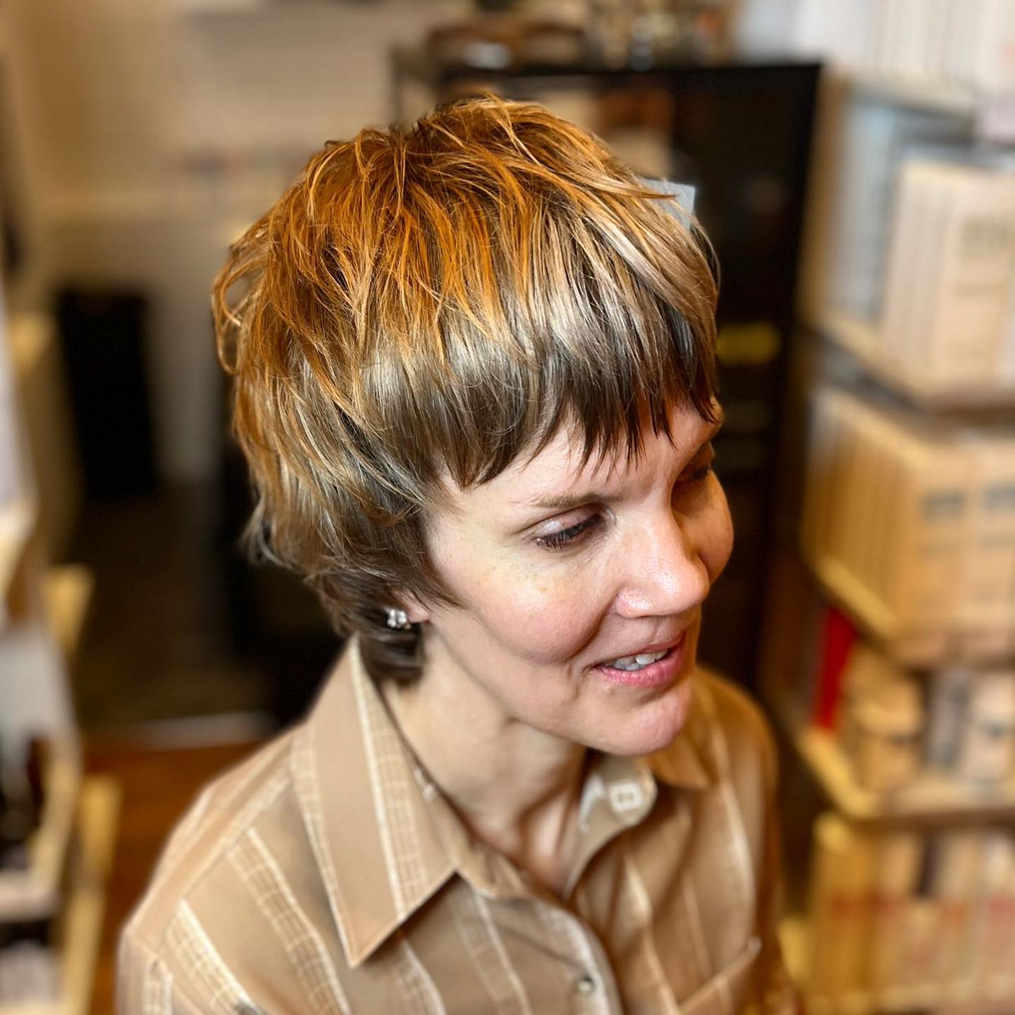 Short Layered Chestnut-Blonde Pixie with Razored Fringe and Crown Texture
