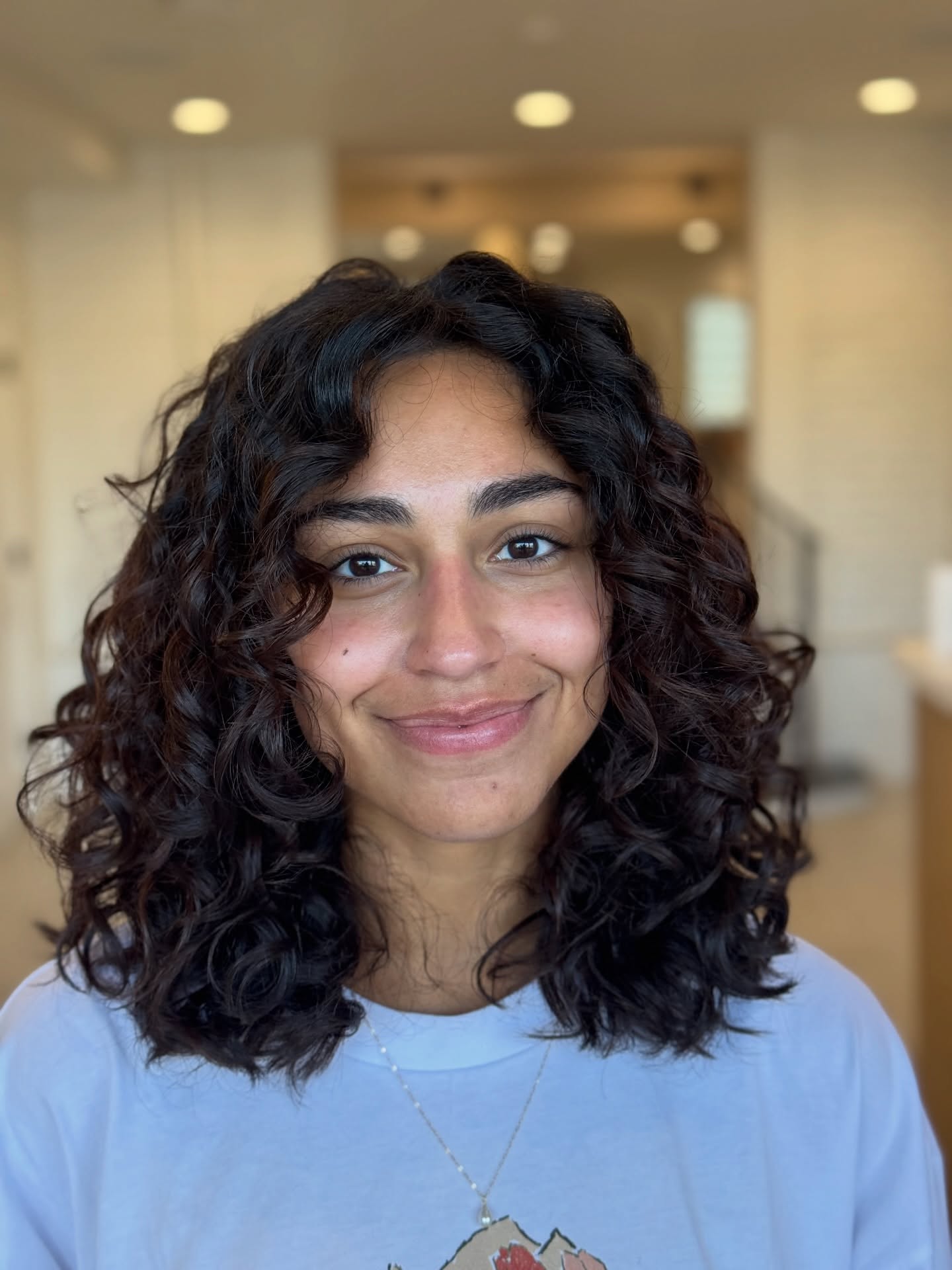 Shoulder-Skimming Curly Lob with Long Face-Framing Layers