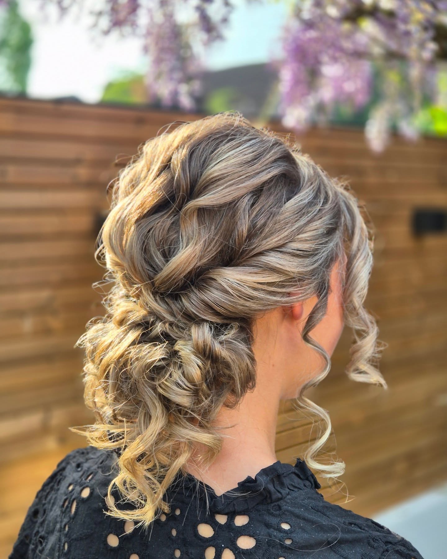 Twisted Low Curly Chignon with Hand-Painted Babylights