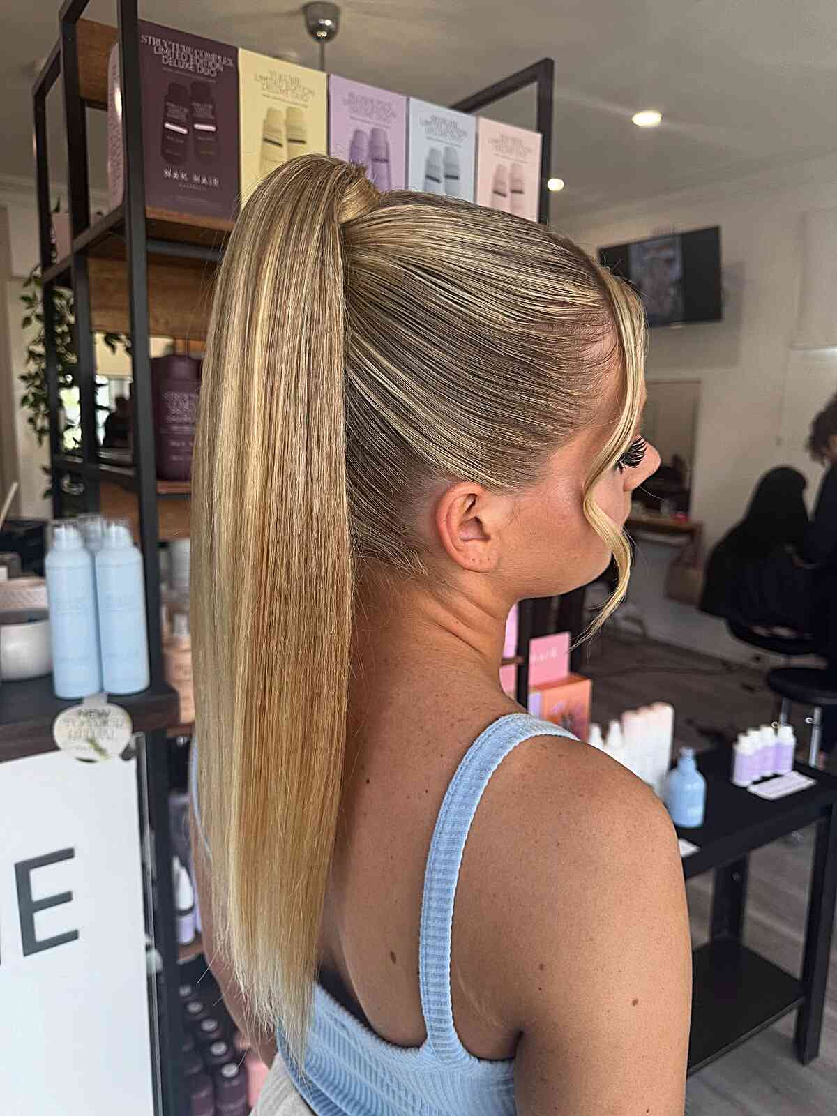 Sleek High Ponytail with Subtle Waves