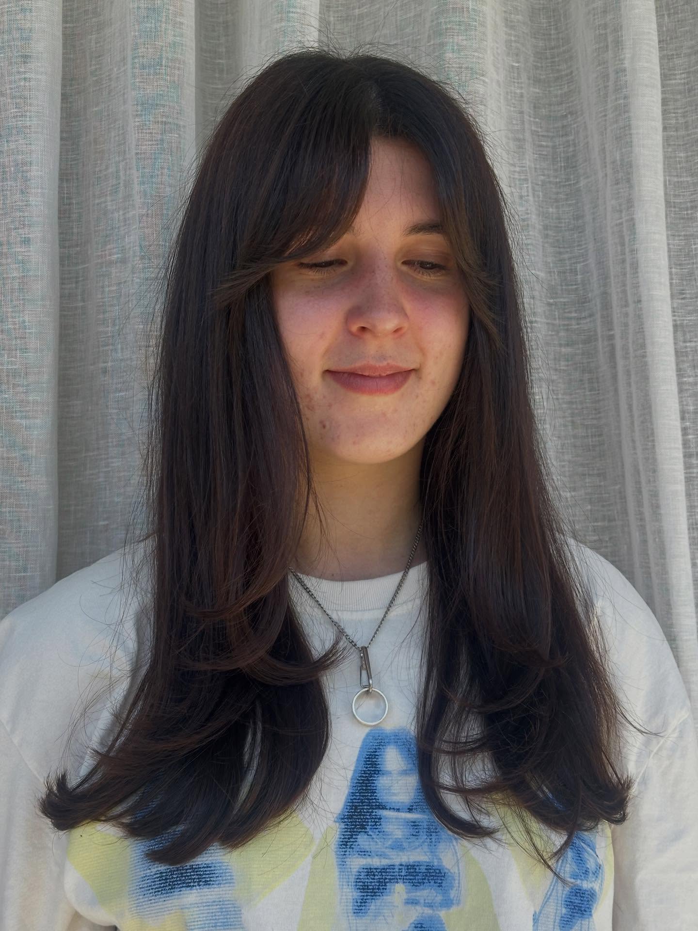 Long Layered Cut with Soft Curtain Bangs