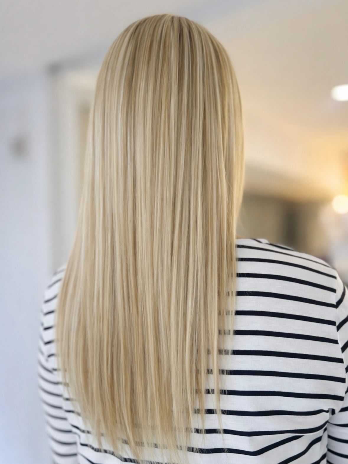 Long Sleek Platinum Blonde Cut with Subtle Textured Ends