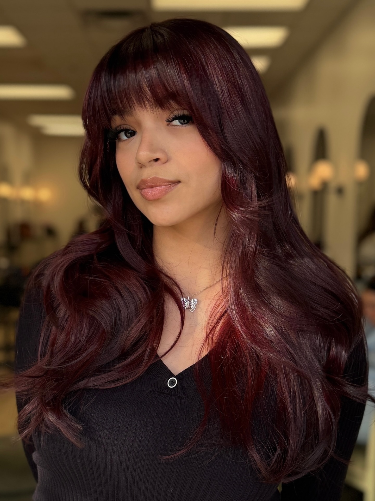 Rich Burgundy Long Layers with Bold Bangs