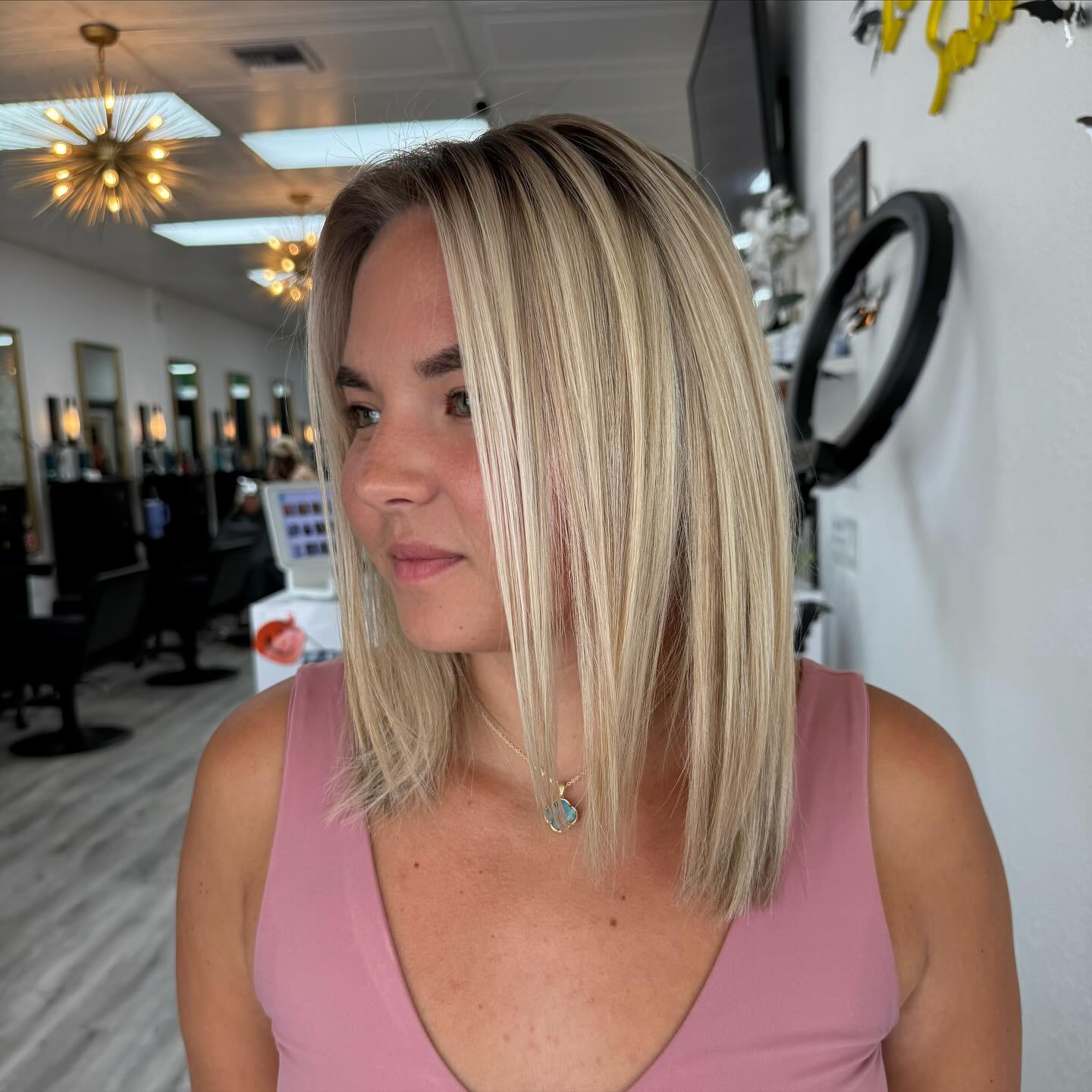 Sleek Shoulder-Length Blonde Cut with Subtle Face-Frames