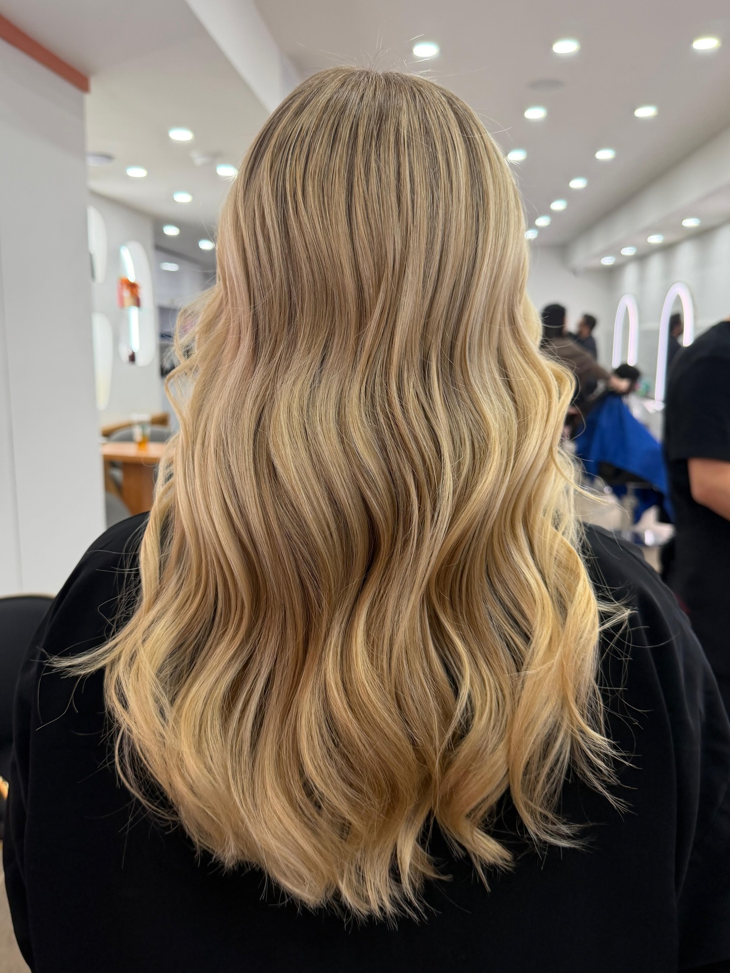 Softly Layered Golden Blonde Waves with Natural Movement