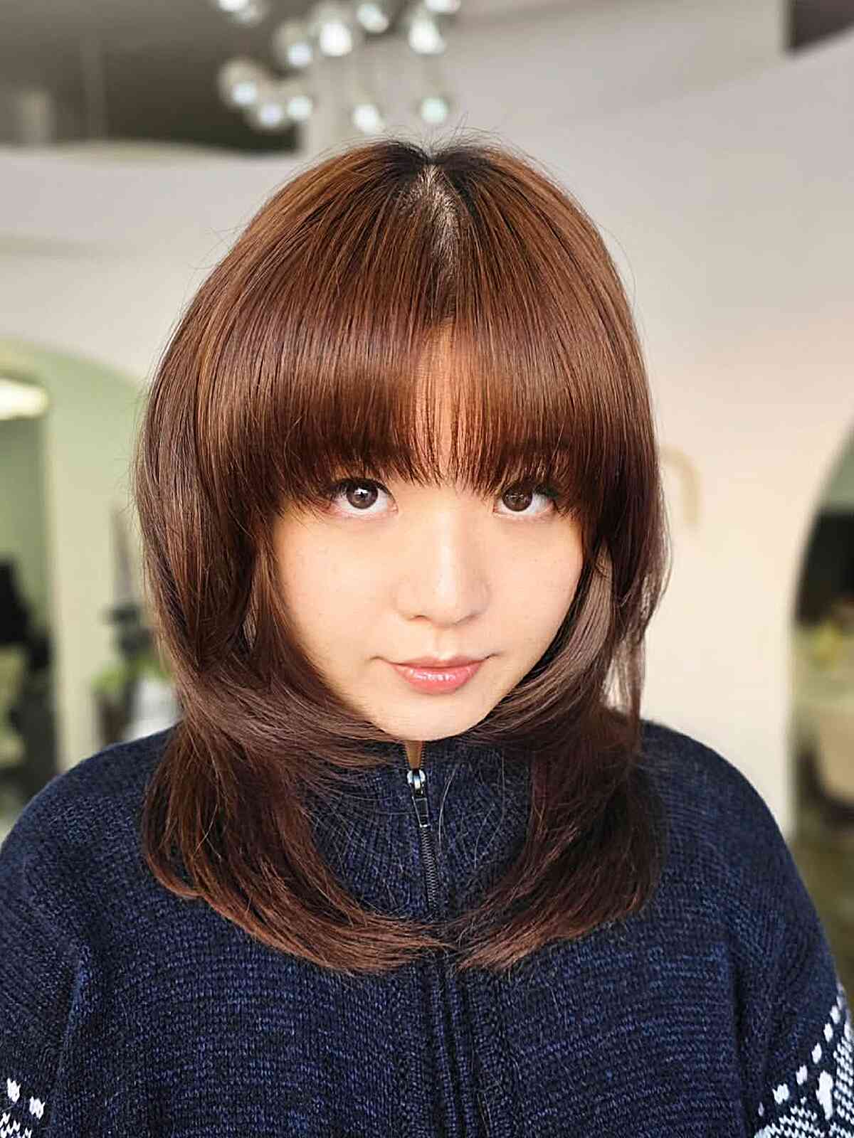 Sleek Mid-Length Haircut with Soft Bangs