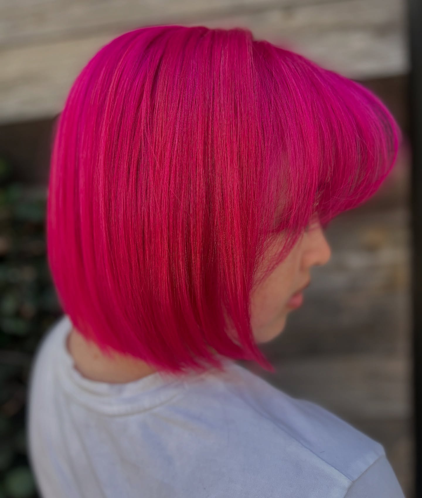 Bold Asymmetrical Pink Bob with Blunt Bangs